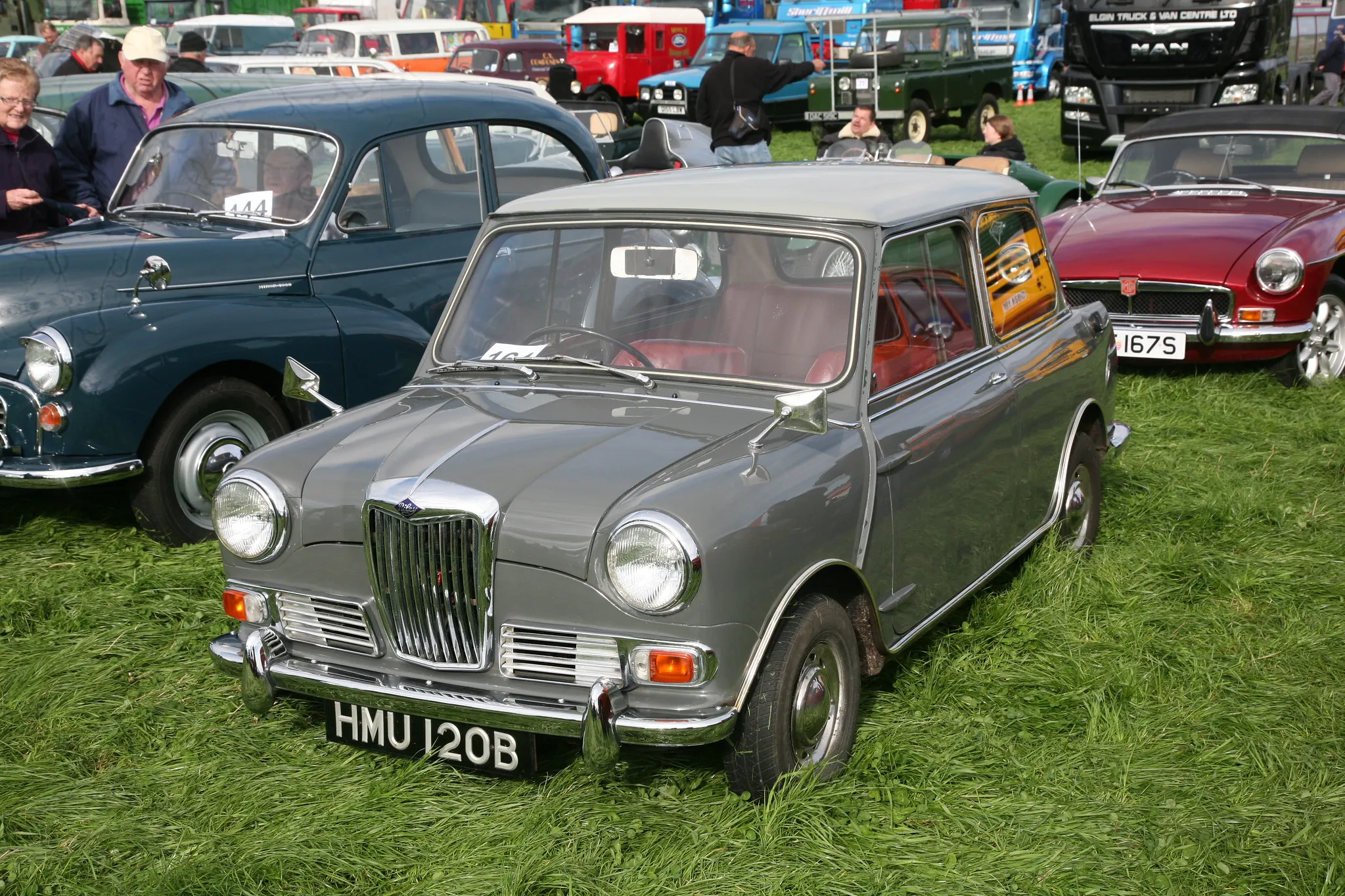 A grey Riley Elf saloon at a show, front three-quarter view showing the traditional grille