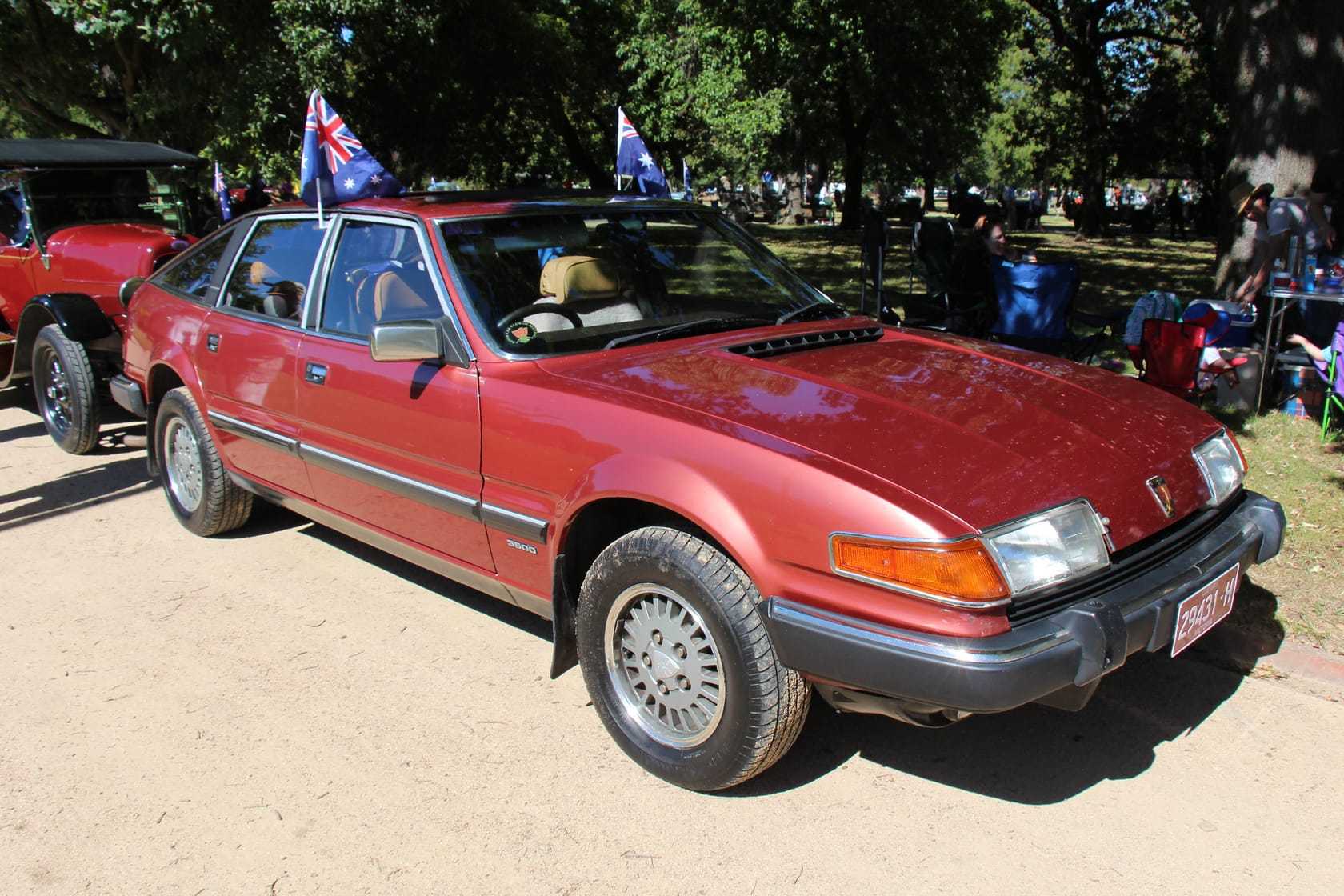 A red 1983 Rover SD1 3500 Series II at a classic car show, front three-quarter view