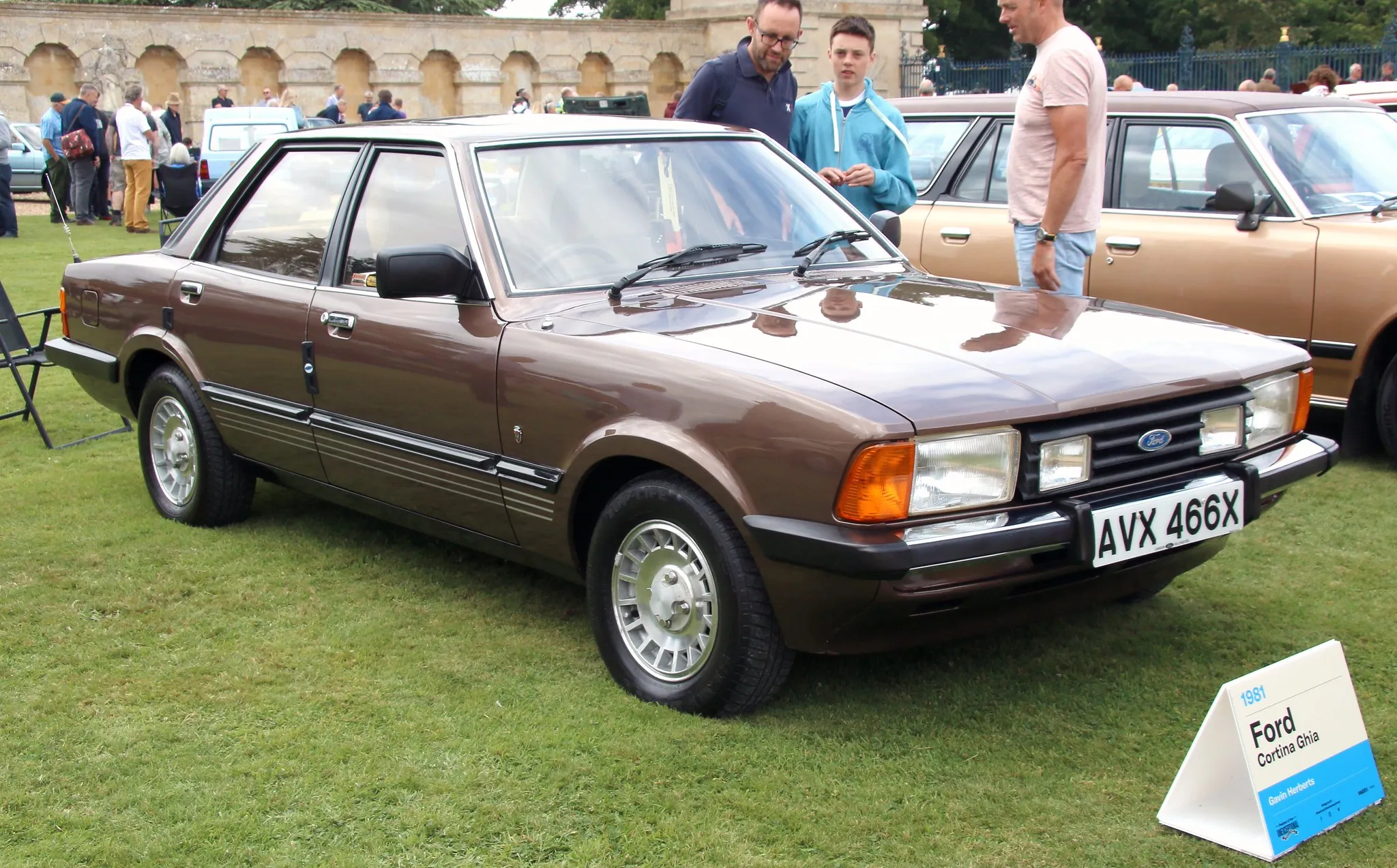 A bronze 1981 Ford Cortina Ghia four-door saloon, the Cortina 80 facelift, on display at a classic car show