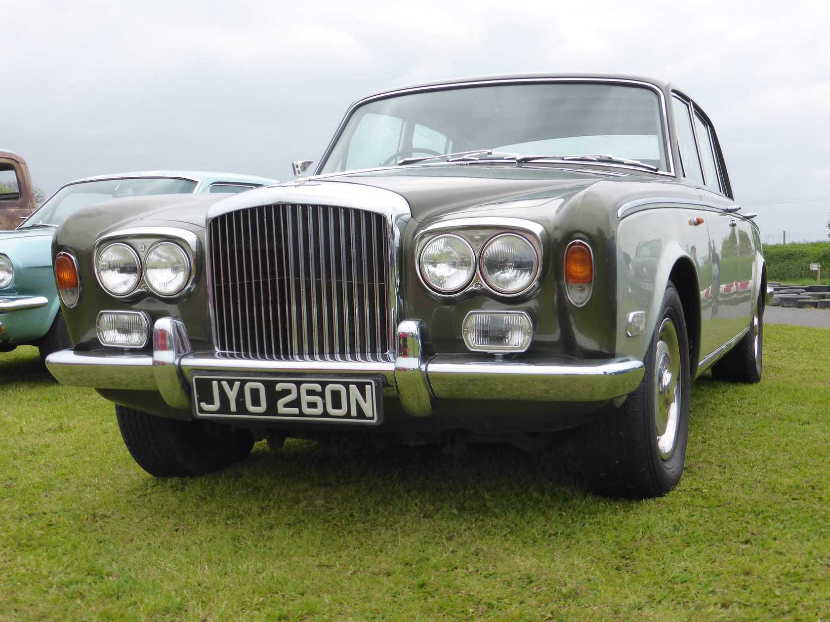 A silver-green Bentley T1 with UK registration JYO 260N at a classic car show