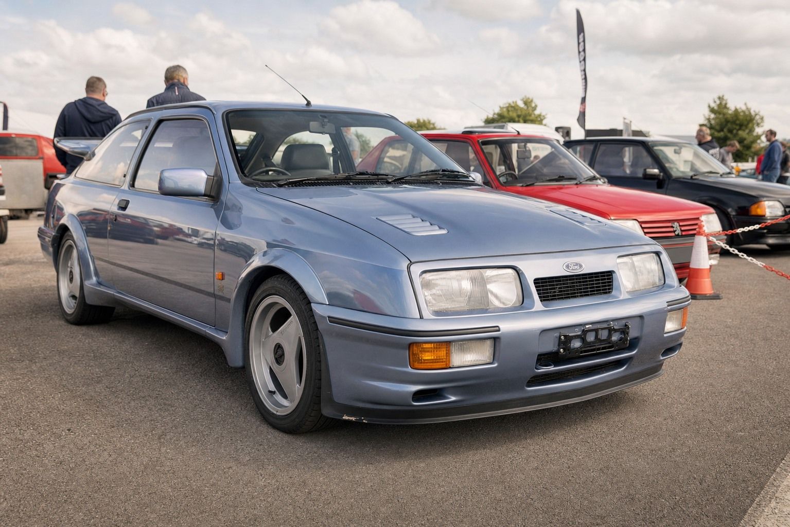 A Ford Sierra RS Cosworth 3-door in Moonstone Blue at a UK classic car show