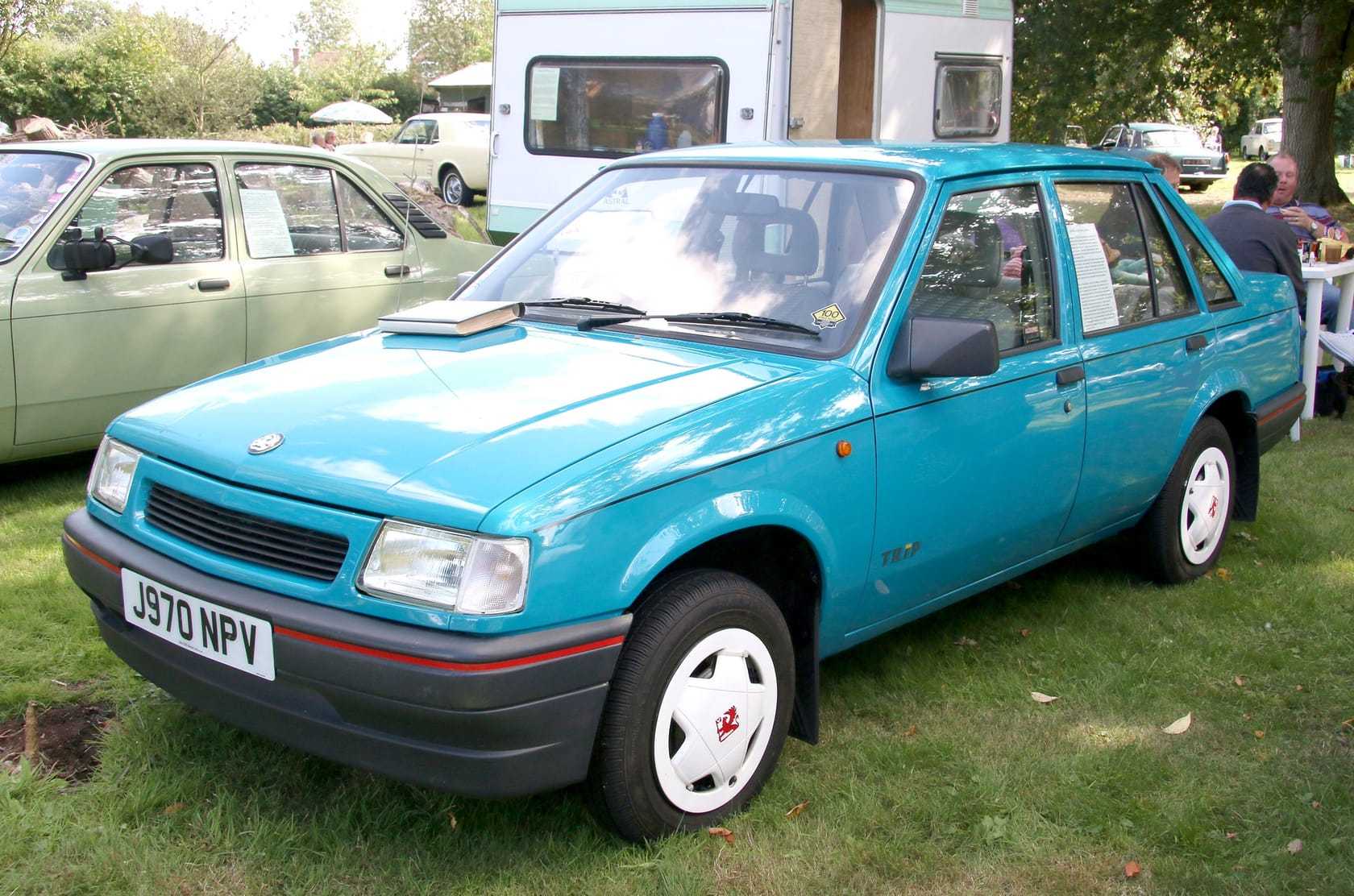 A teal Vauxhall Nova with UK registration J970 NPV on a show field