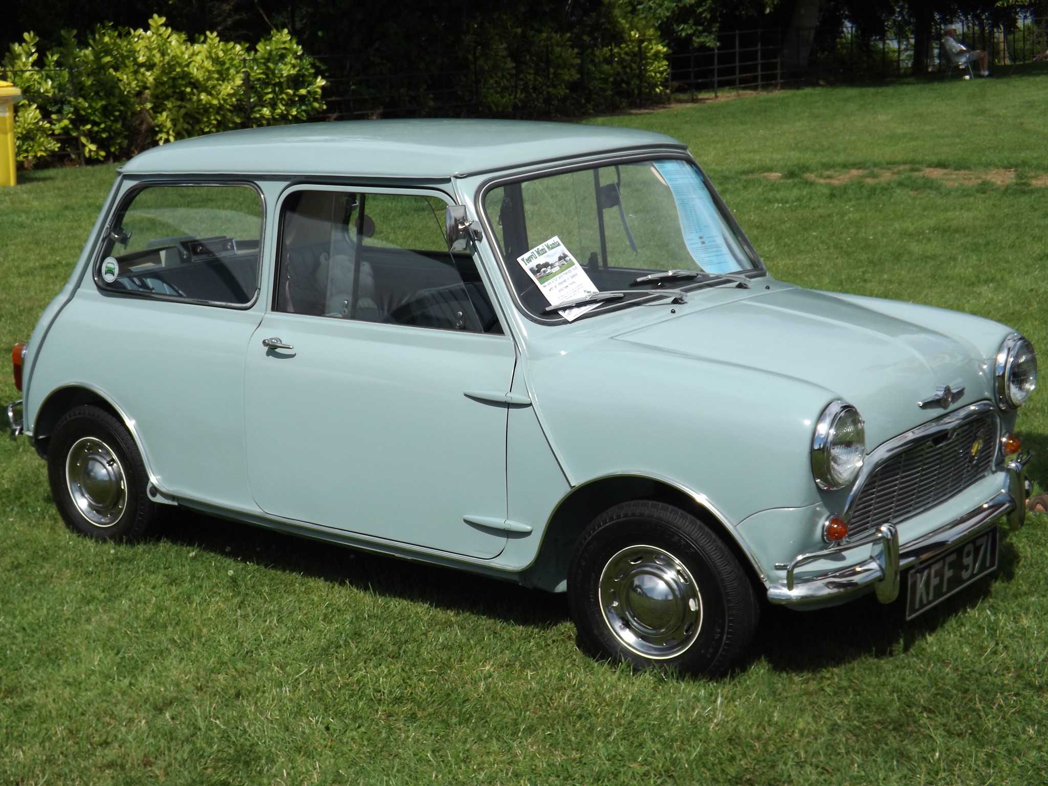 A pale blue 1960 Morris Mini-Minor at a show, side view