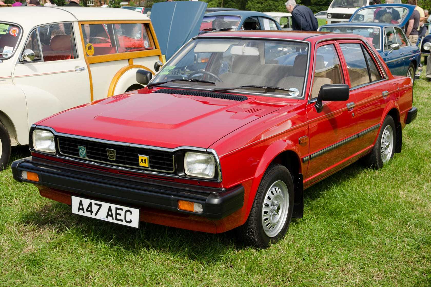 A red 1983 Triumph Acclaim at a classic car show, front three-quarter view, UK registration A47 AEC