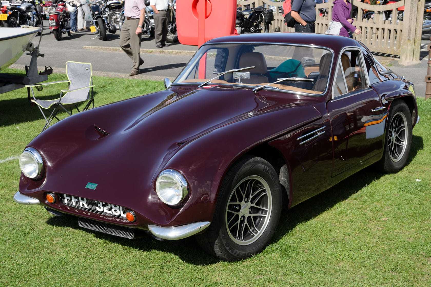 A maroon 1966 TVR Griffith 400 with UK registration FPR 828C, front three-quarter view