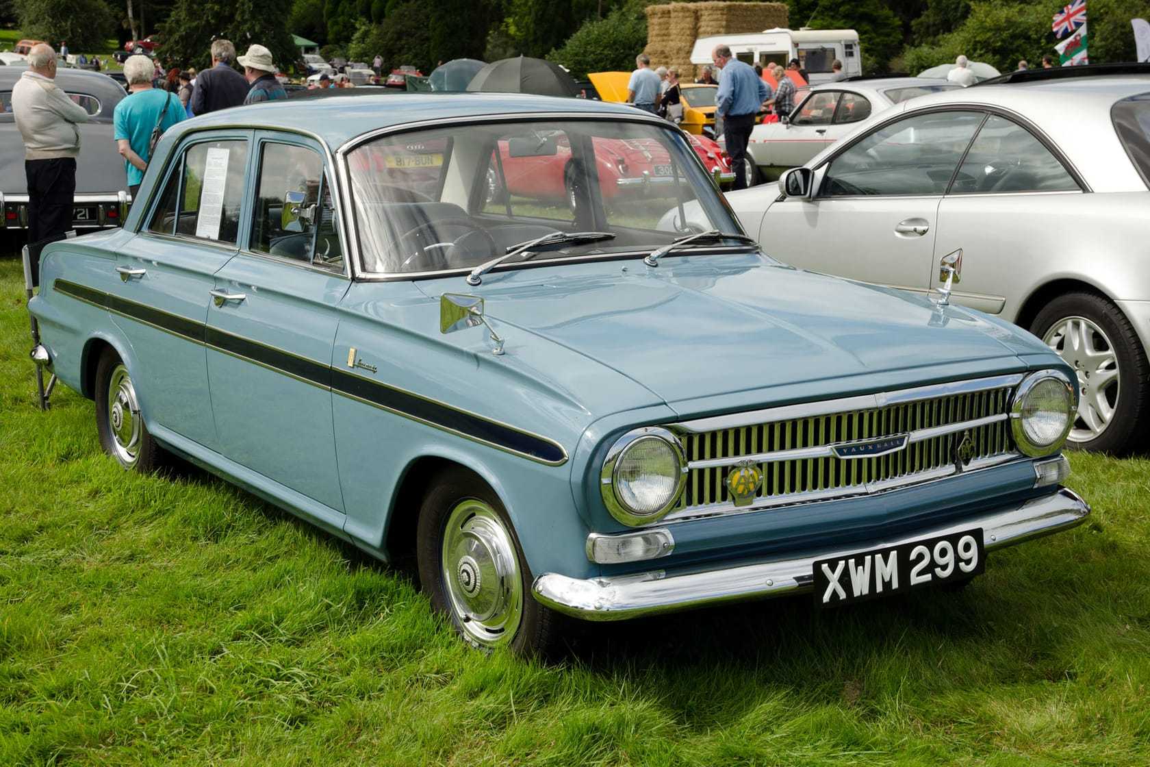 A light blue 1963 Vauxhall VX4/90 FB with UK registration XWM 299, front three-quarter view at a classic car show