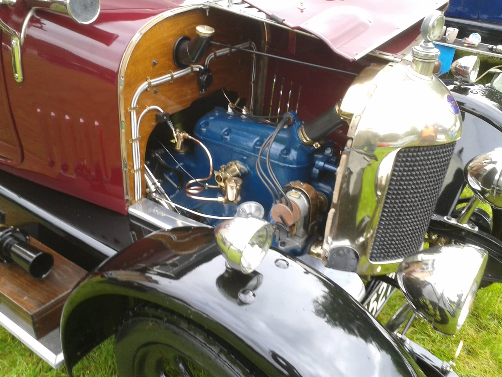 Close-up of the engine bay of a Bullnose Morris Oxford with the bonnet side raised