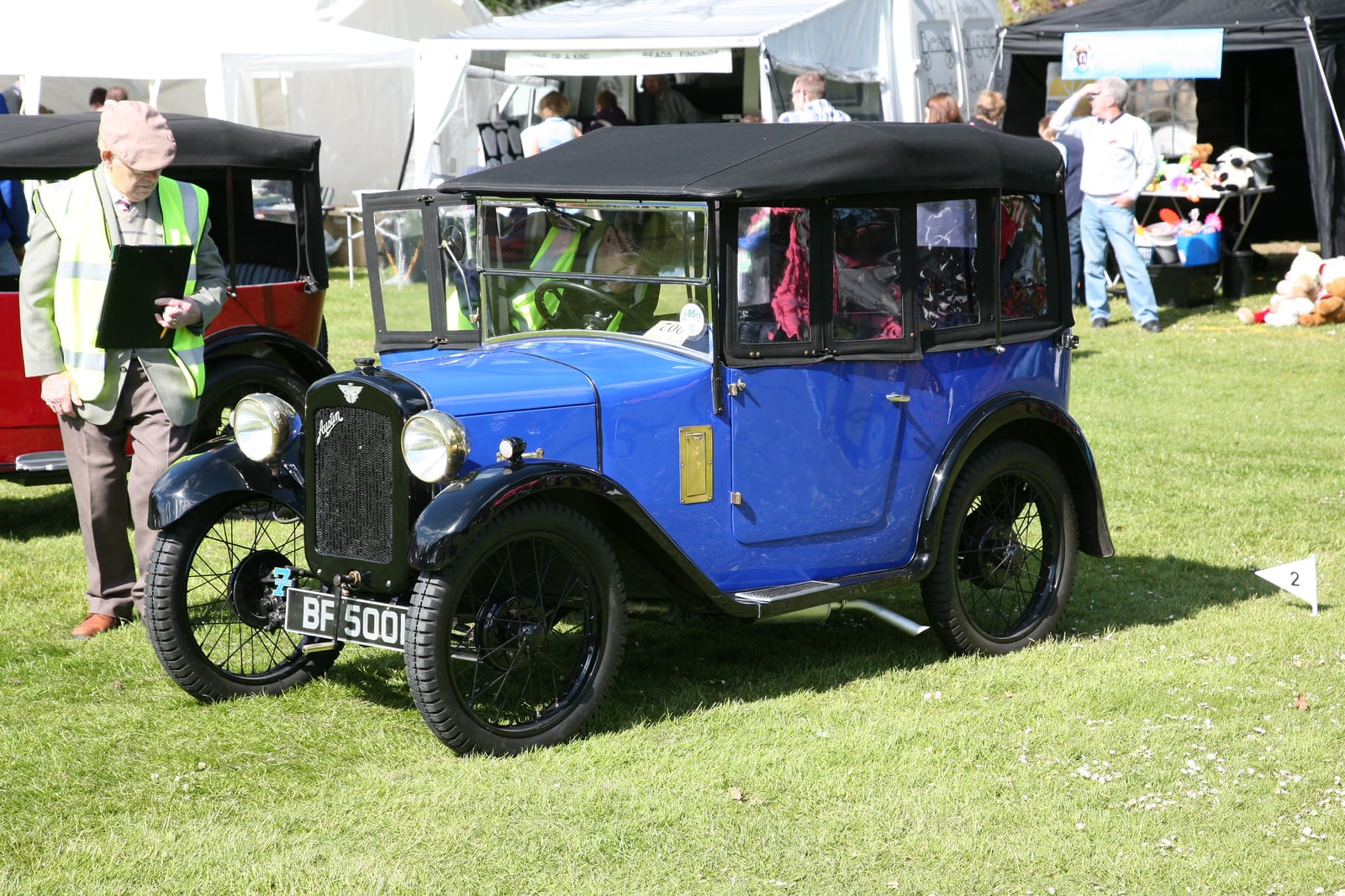 A dark Austin Seven Chummy of 1930 at a show