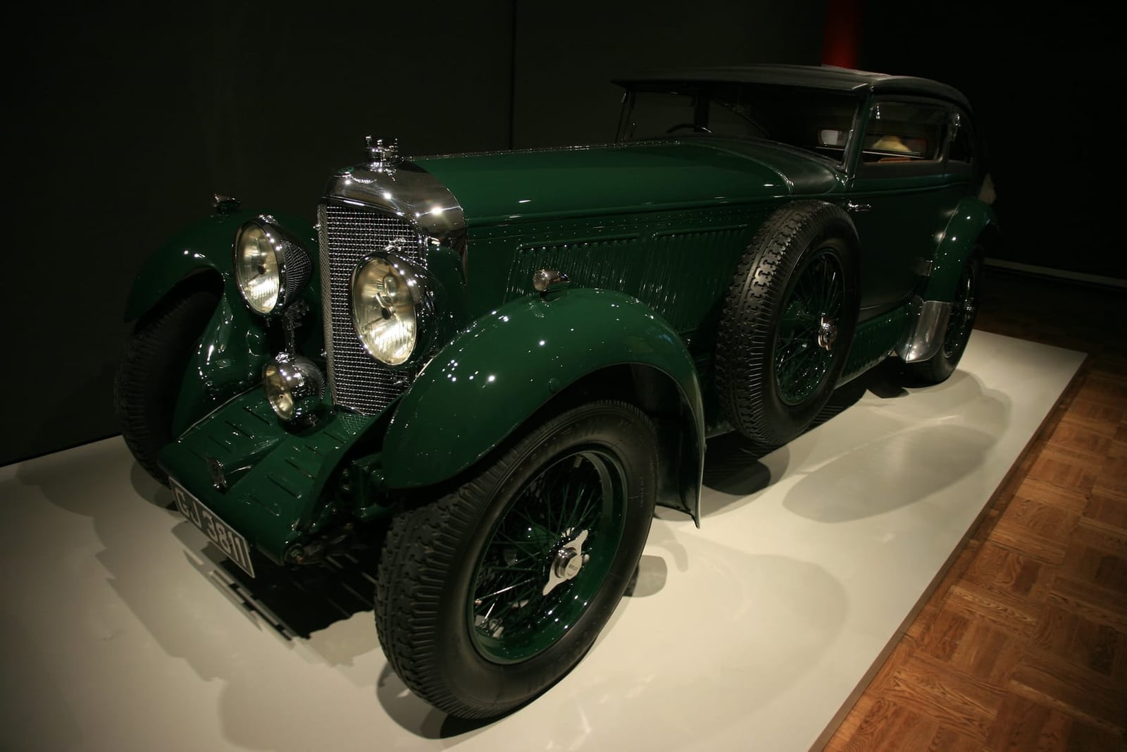 The dark green 1930 Bentley Speed Six Blue Train coupe displayed in a museum