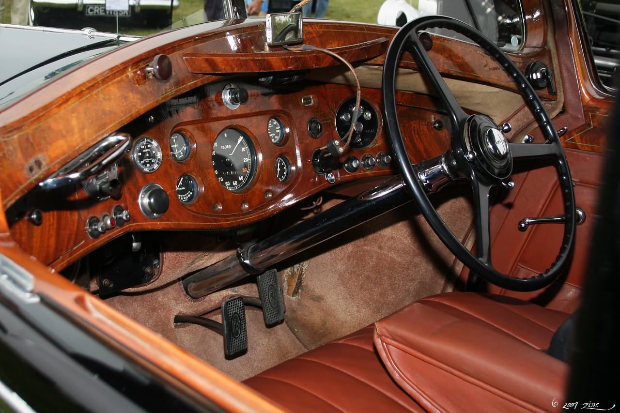 The wood and leather interior of a 1937 Rolls-Royce Phantom III touring limousine by Mulliner