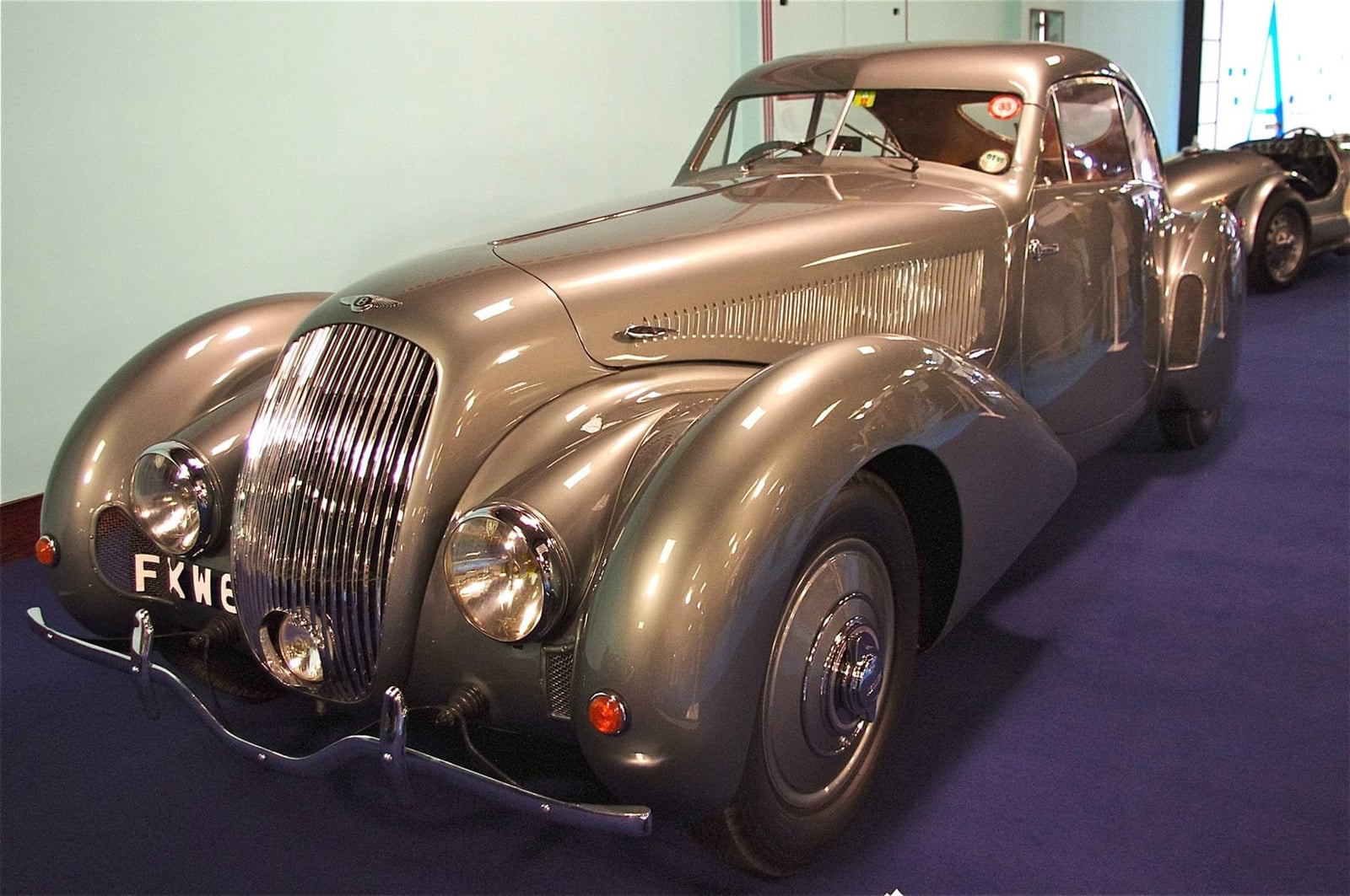 The silver streamlined 1938 Embiricos Bentley 4¼ Litre special in a museum