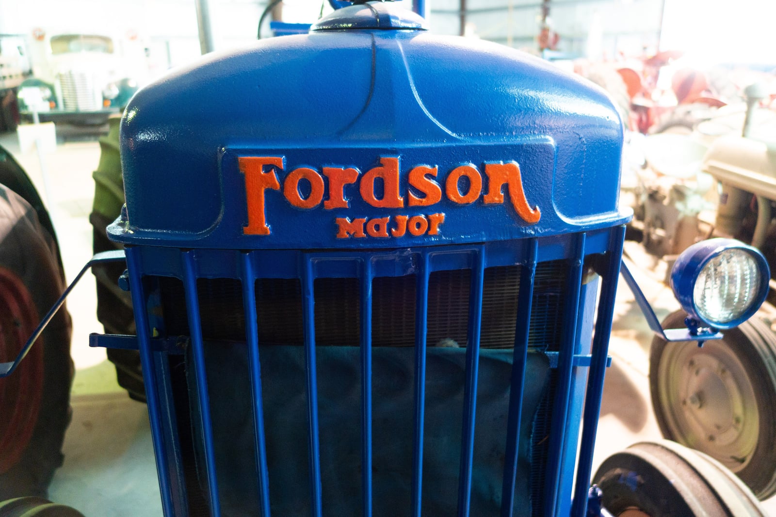Close-up of the Fordson Major name on the grille of a blue E27N tractor