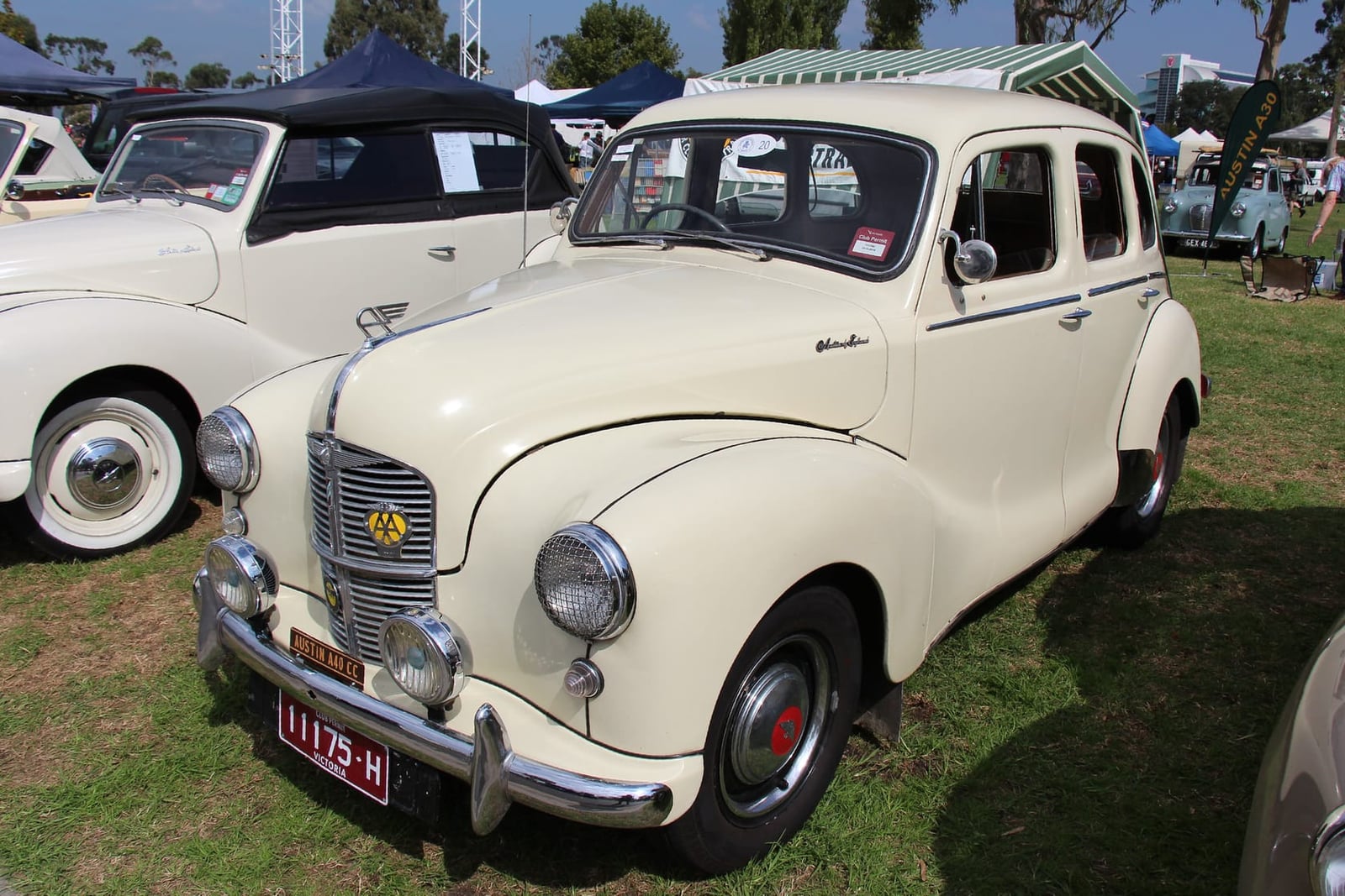 A cream 1950 Austin A40 Devon saloon, front three-quarter view at a classic car show