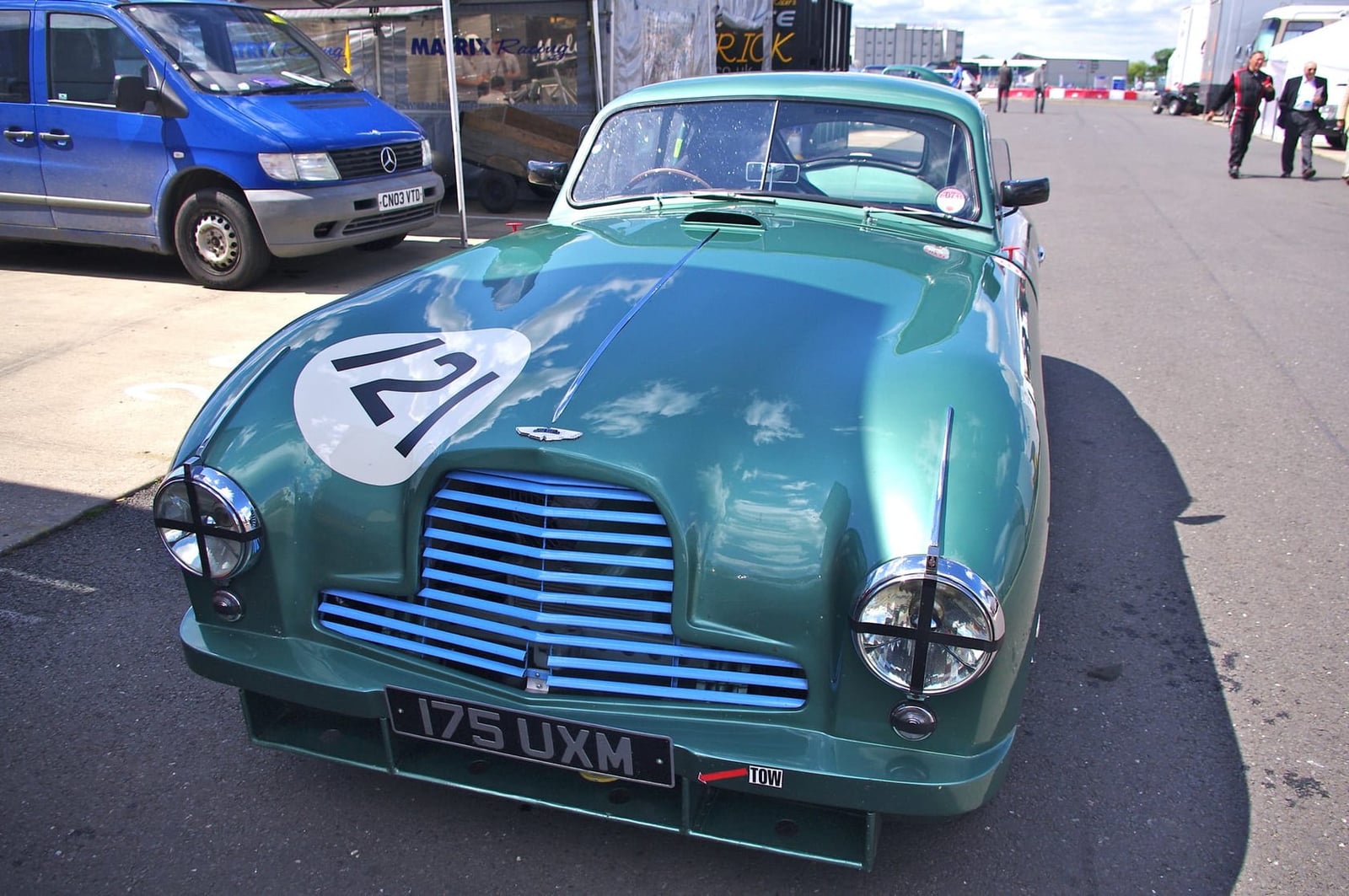 A green 1951 Aston Martin DB2 Le Mans team car displayed in a museum