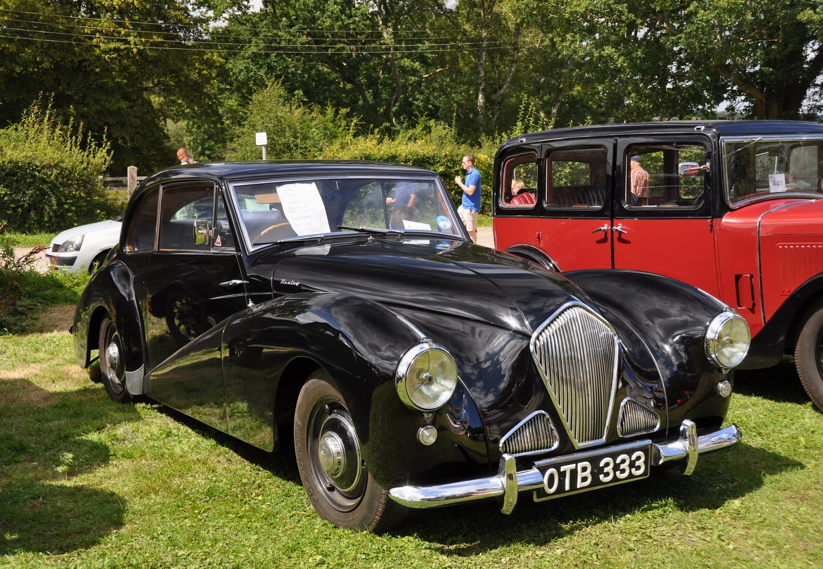 A black 1952 Healey Tickford saloon, the Donald Healey Motor Company's own pre-Austin car