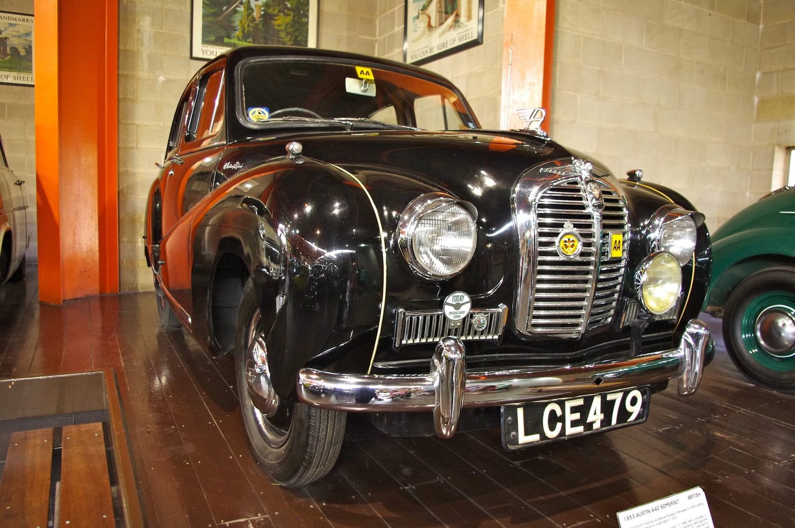 A black 1953 Austin A40 Somerset on museum display, front three-quarter view, UK registration LCE 479
