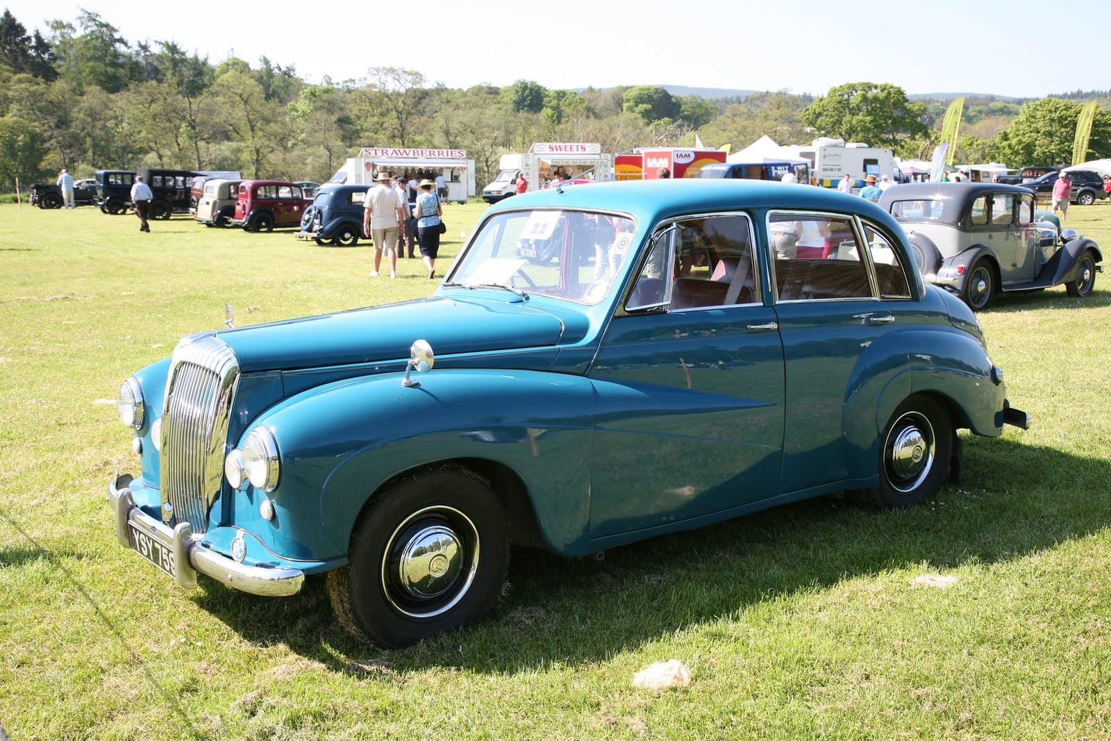 A blue 1953 Daimler Conquest 2.5-litre at a show, front three-quarter view, UK registration YSY 759