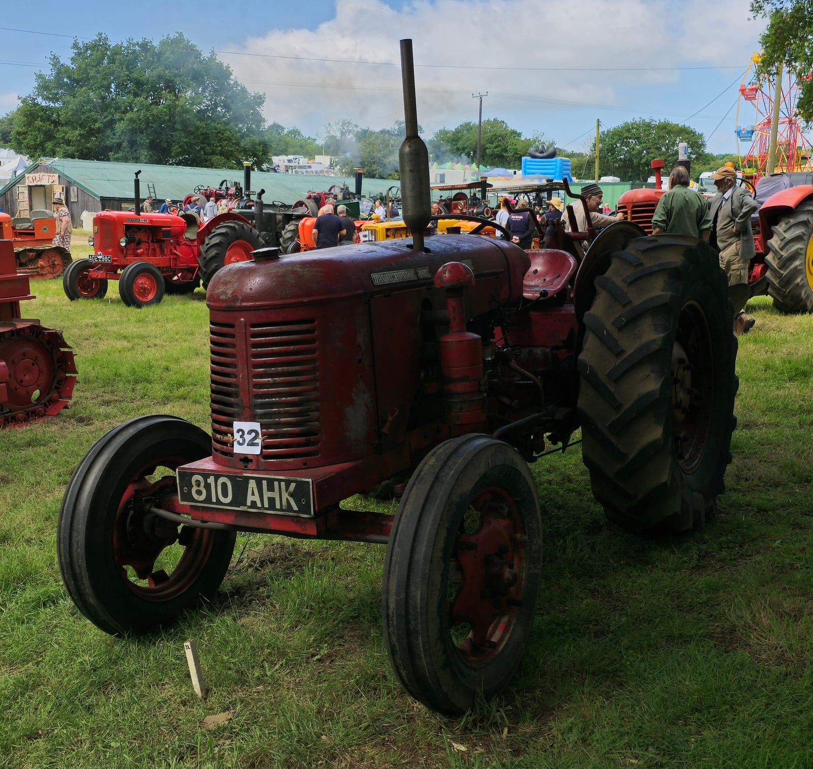 A red David Brown 30C, registration 810 AHK, at a vintage steam fair
