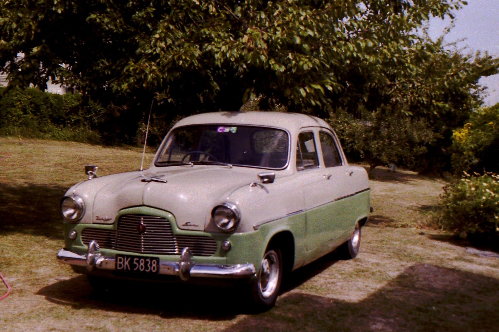 A cream Ford Zephyr Mk1 saloon at a show, front three-quarter view