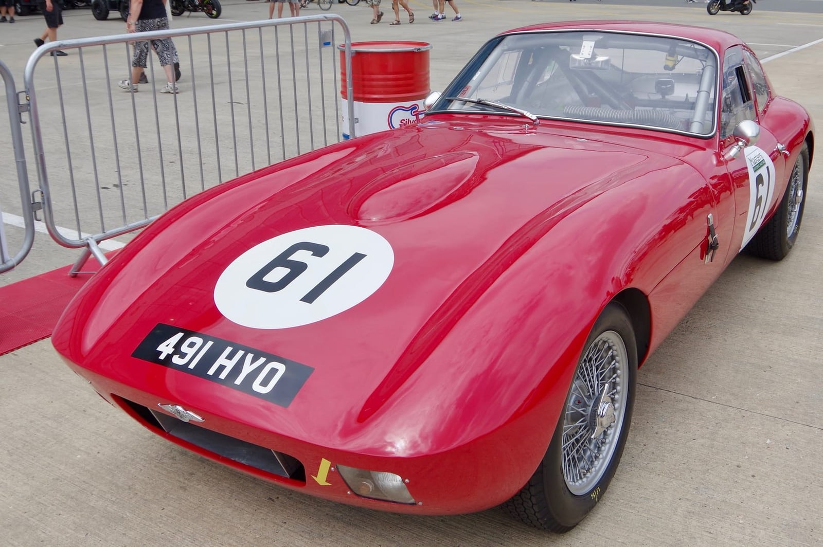 A red 1962 Morgan Plus 4 SLR streamlined coupe with racing number 61 and UK registration 491 HYO