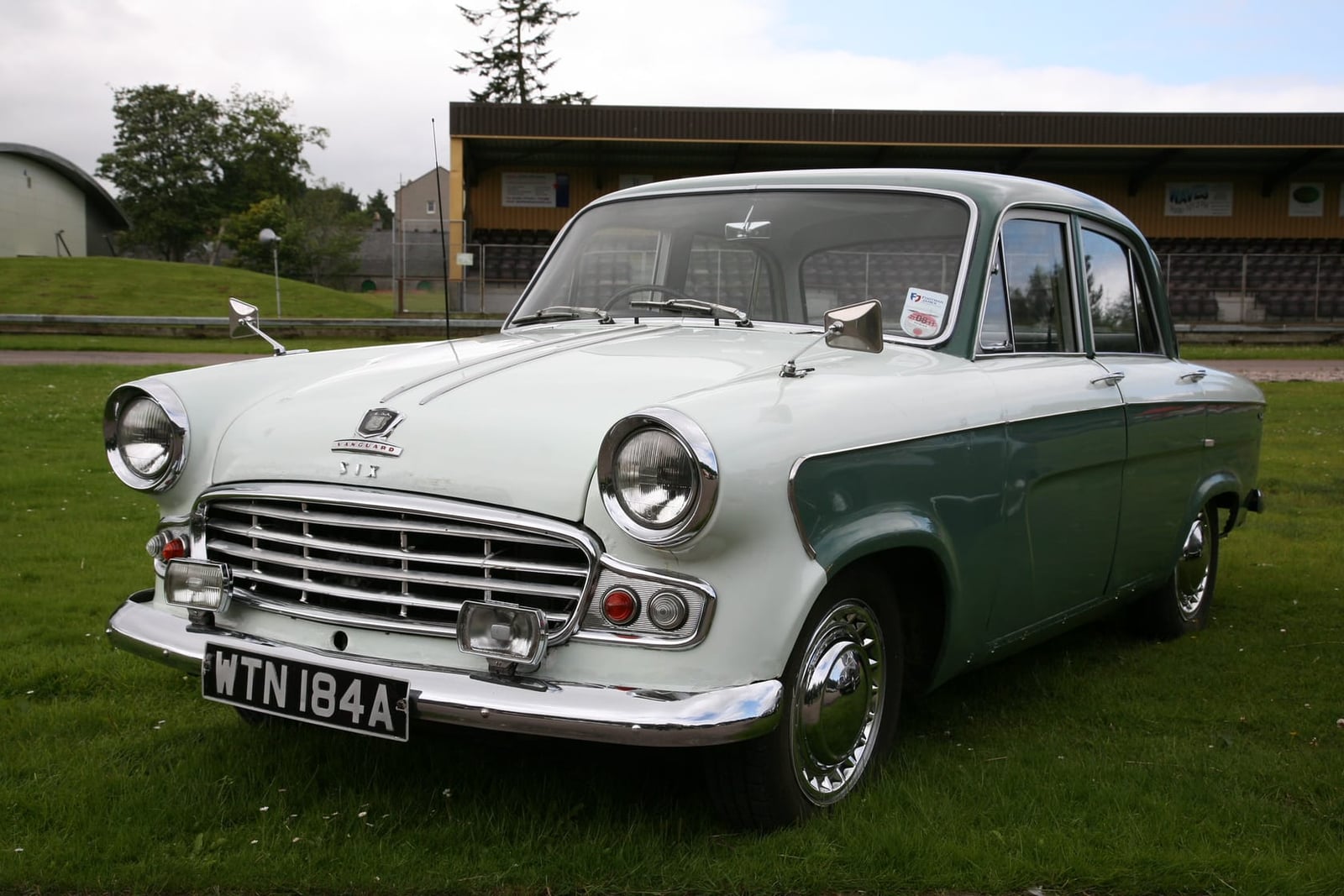 A white and green two-tone late Standard Vanguard on grass, front view, UK registration WTN 184A