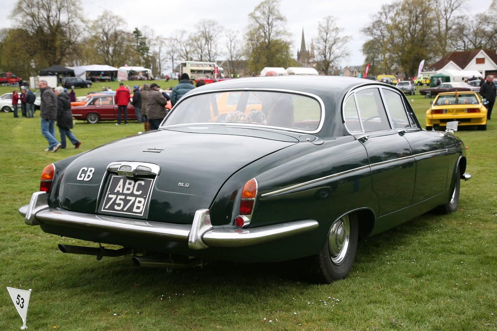 The rear of a dark green 1964 Jaguar Mk10 at a showfield, UK registration ABC 757B