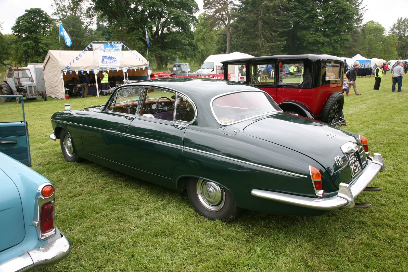 A dark green Jaguar Mk X on grass at a classic car show, side view, UK registration ABC 757B