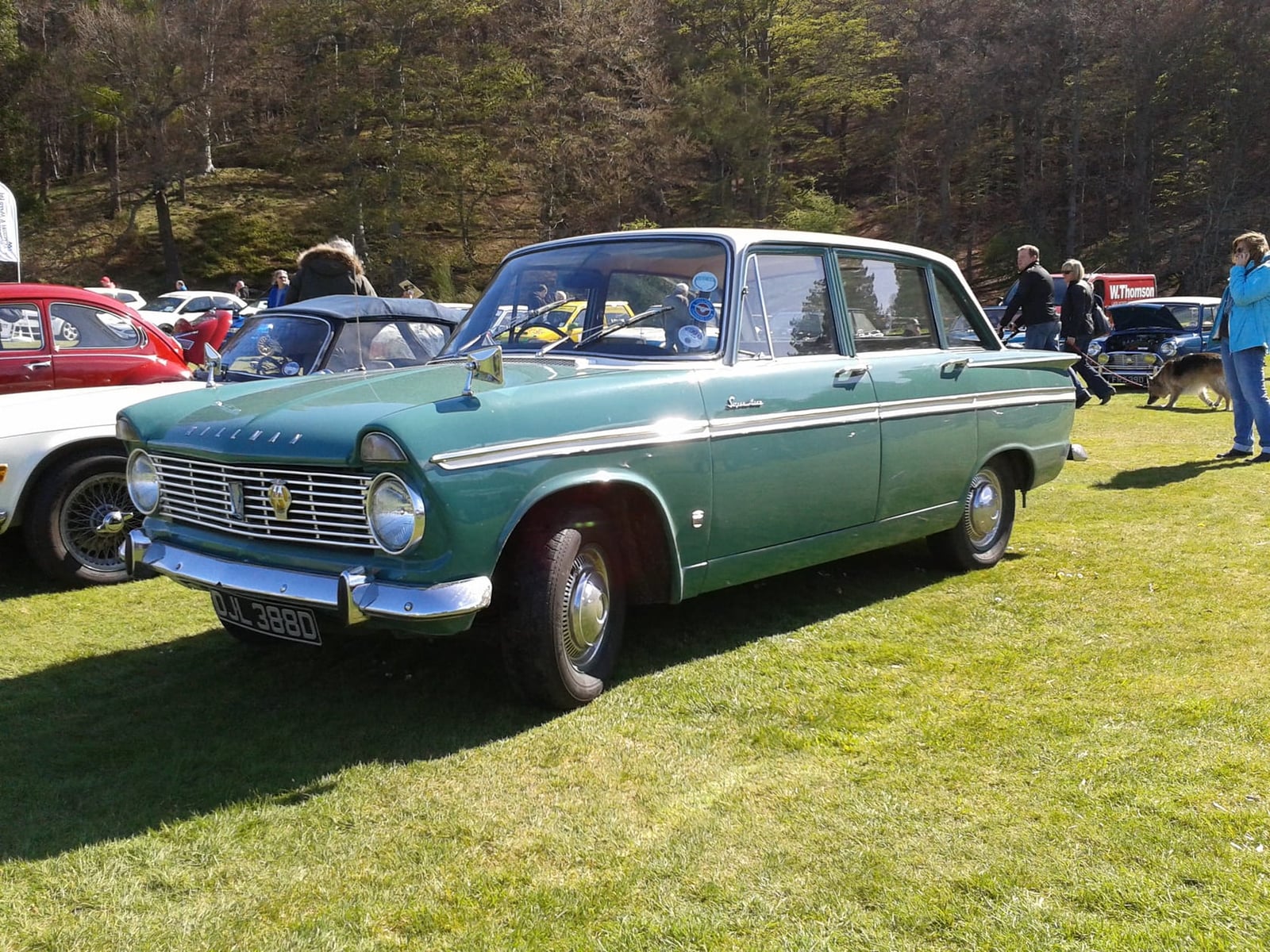 A green 1966 Hillman Super Minx saloon on grass, front three-quarter view