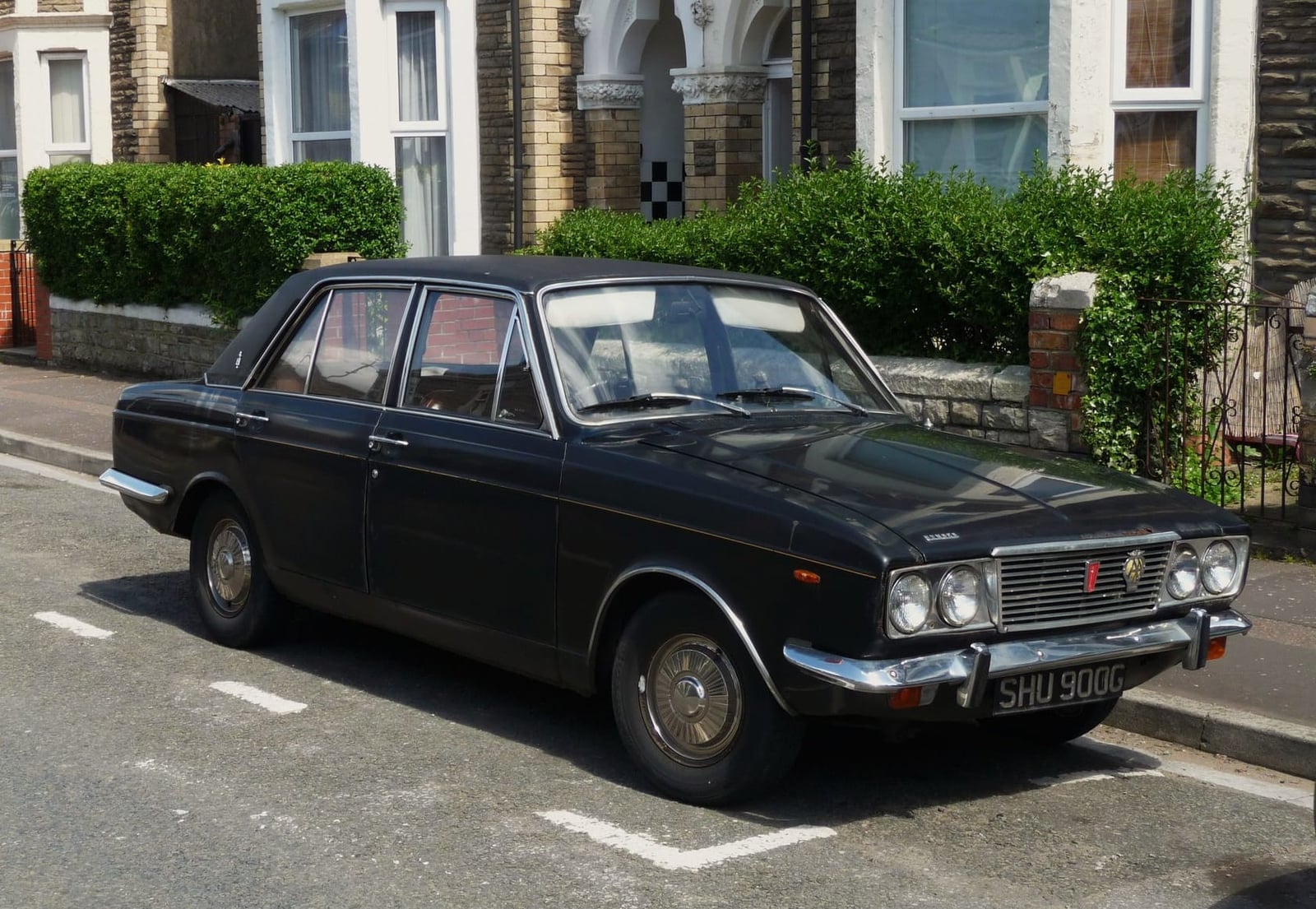 A black 1969 Humber Sceptre parked on a suburban street, side view