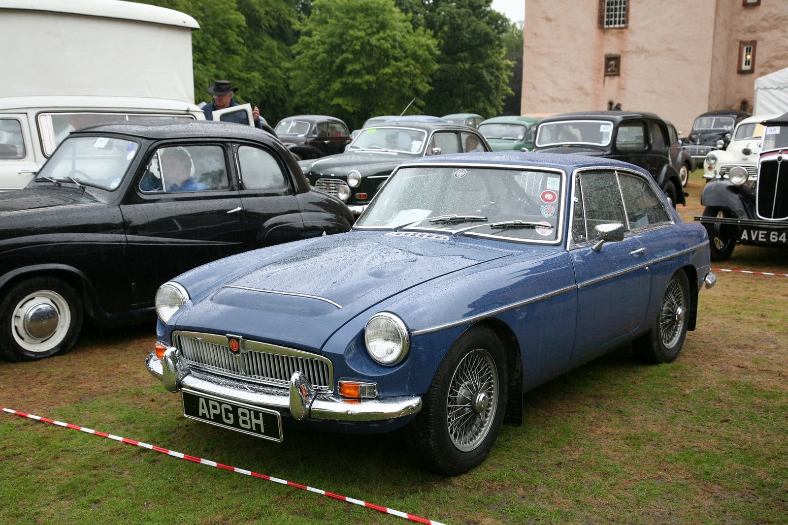 A blue MG MGC GT, front three-quarter view at a show