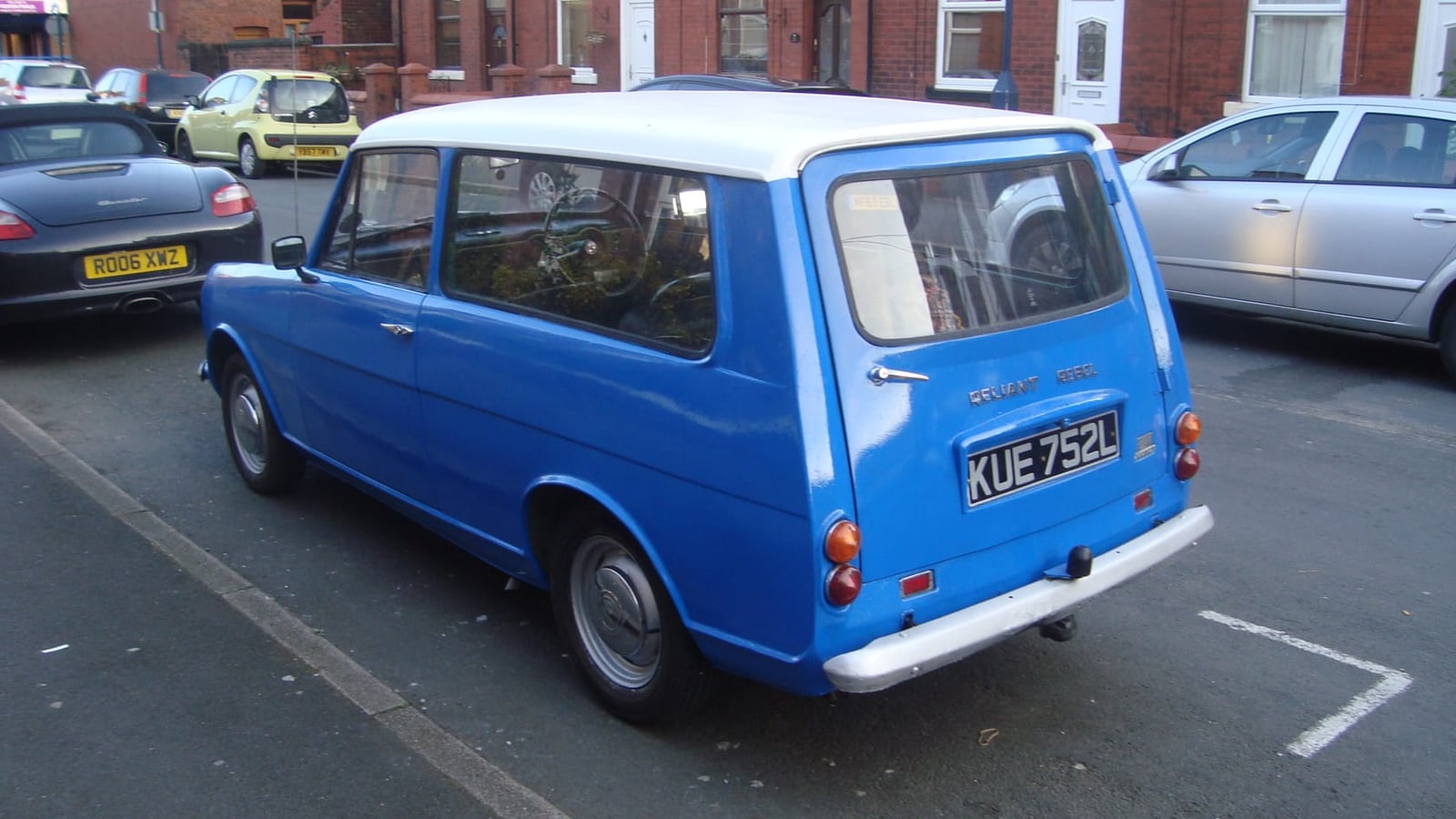 A blue 1972 Reliant Rebel 700 estate parked on a street, rear three-quarter view showing the tailgate