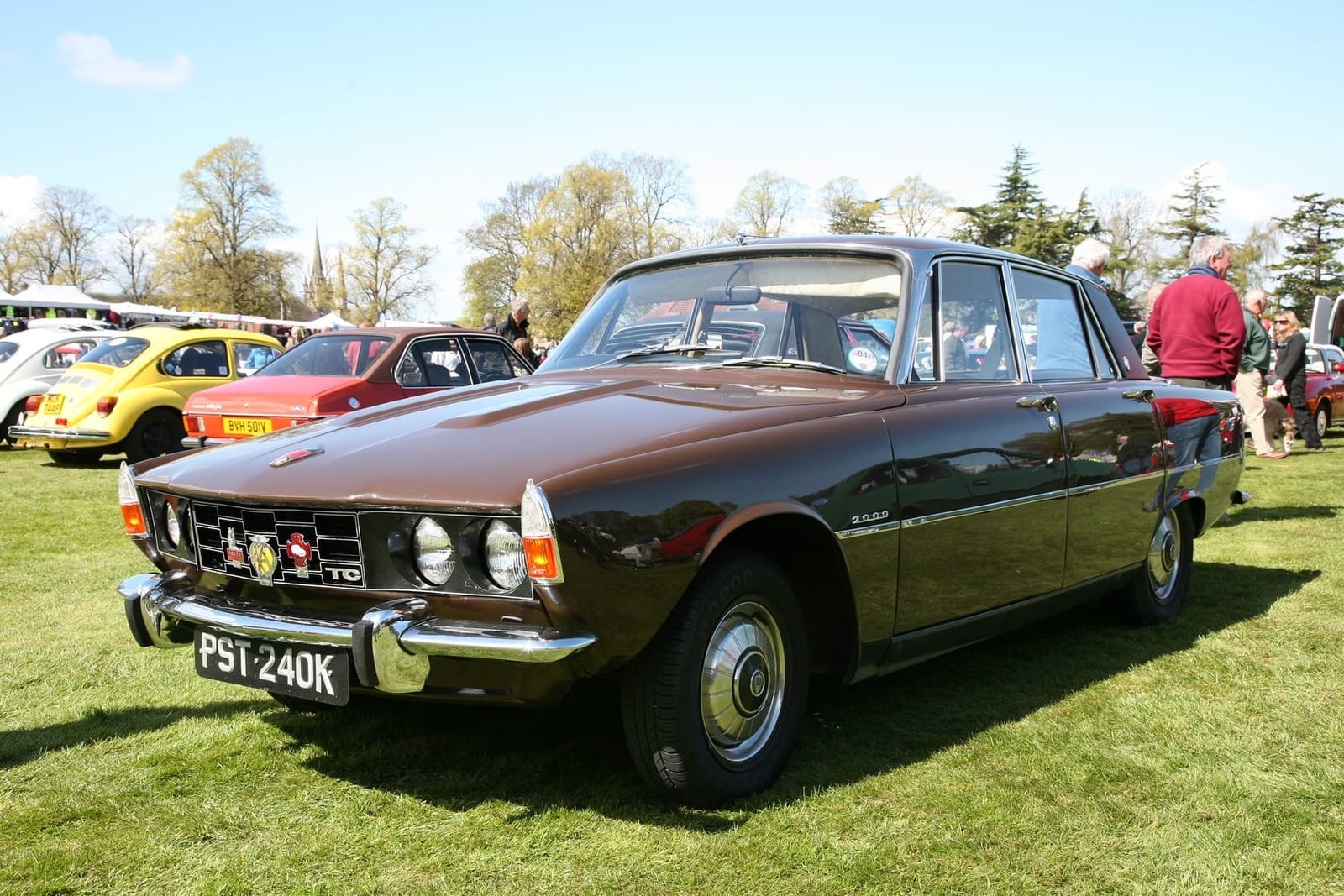 A maroon 1972 Rover P6 2000TC at a classic car show, front three-quarter view, UK registration PST 240K