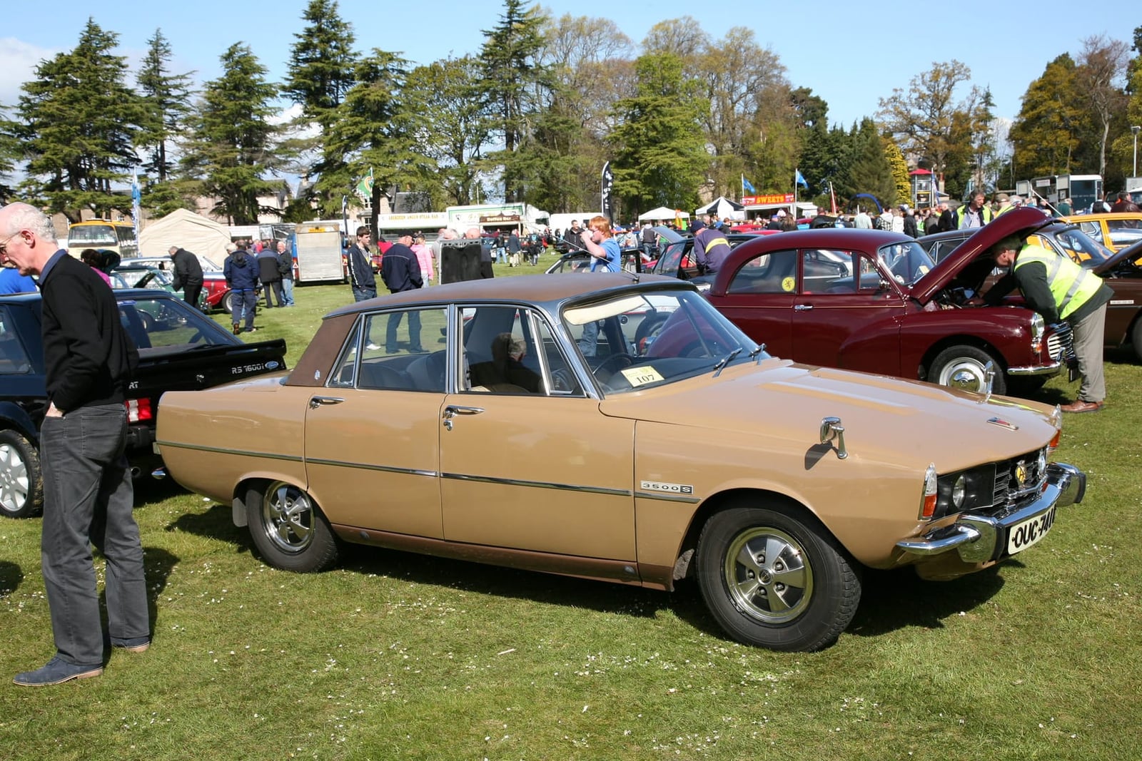 A gold 1972 Rover P6 3500S V8 at a classic car show, front three-quarter view