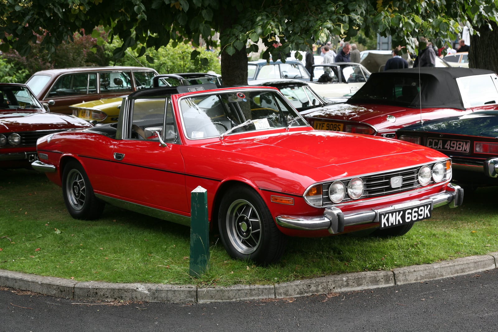 A red Triumph Stag, front three-quarter view at a show