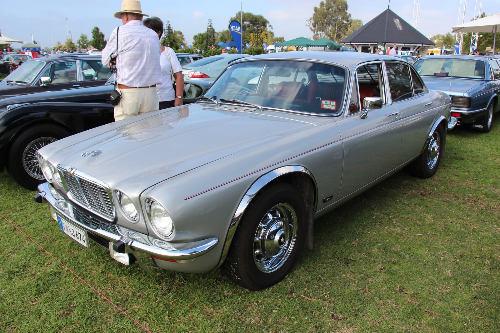 A silver Jaguar XJ6 Series 2 saloon at a show, front three-quarter view