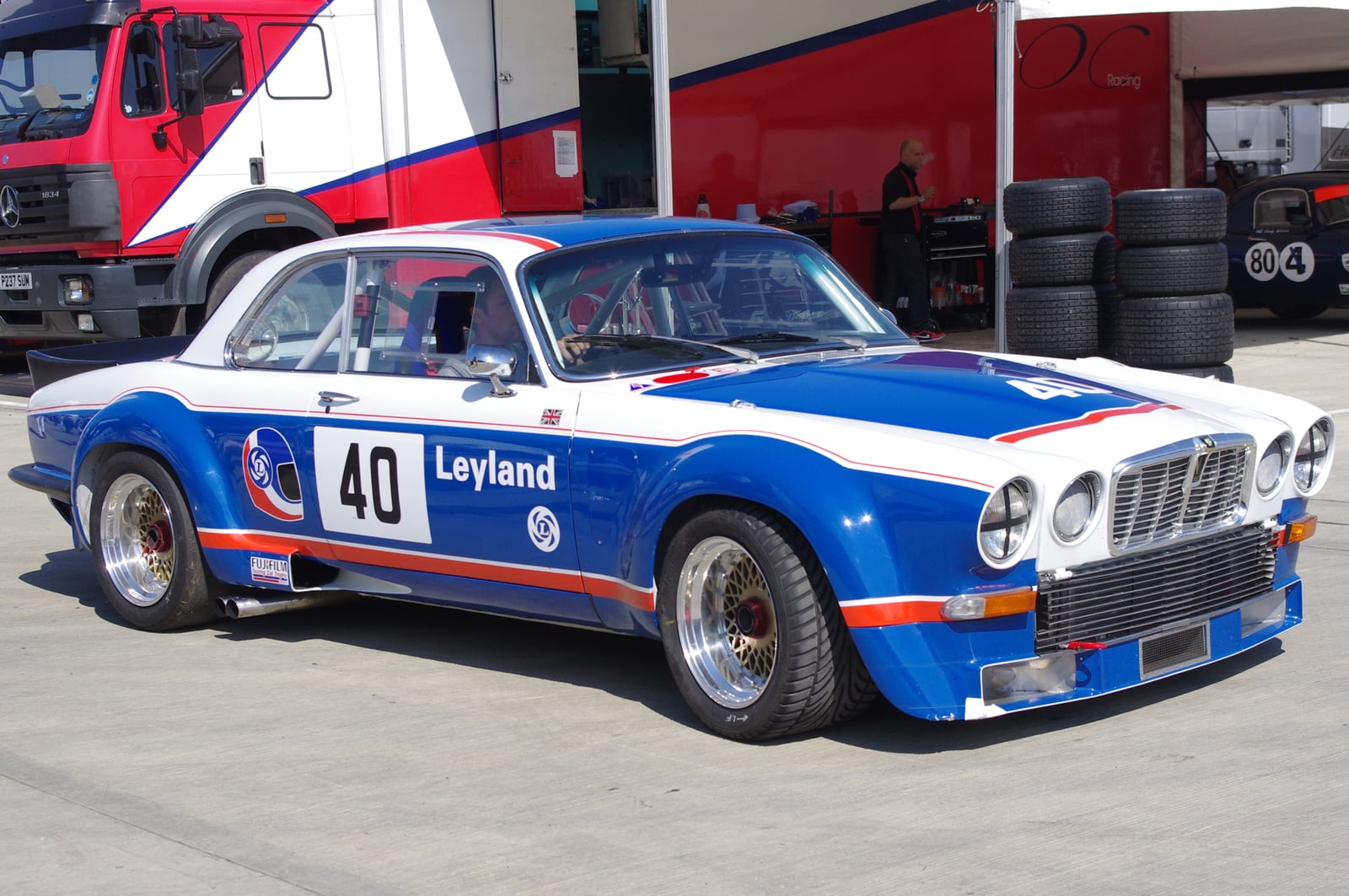 A Jaguar XJ12 coupe racing car in white, blue and red British Leyland livery, number 40