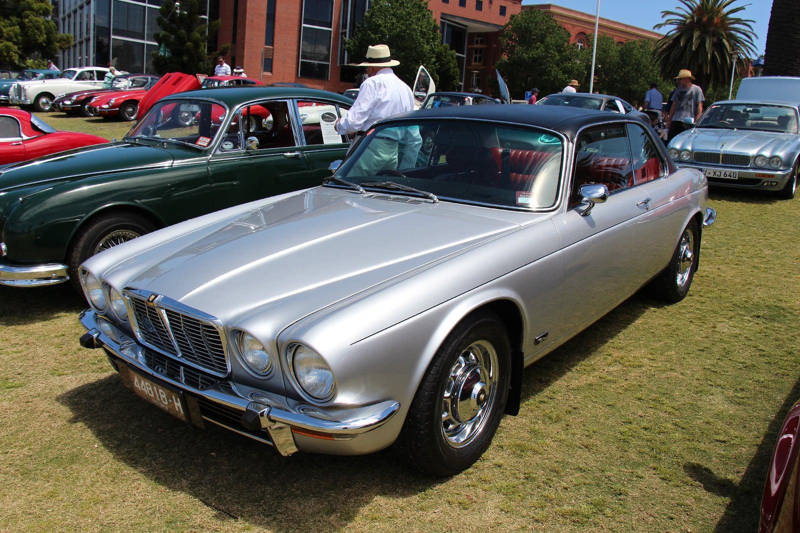 A silver two-door Jaguar XJ6 Series 2 coupe, the pillarless XJ-C, parked on grass