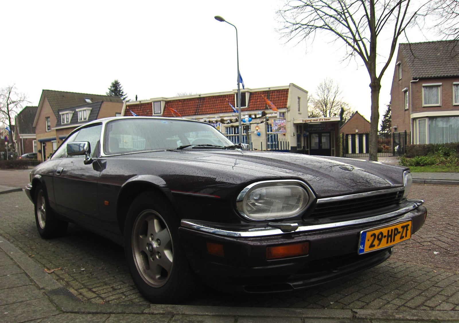 A dark Jaguar XJS 5.3 V12 coupe, front three-quarter view