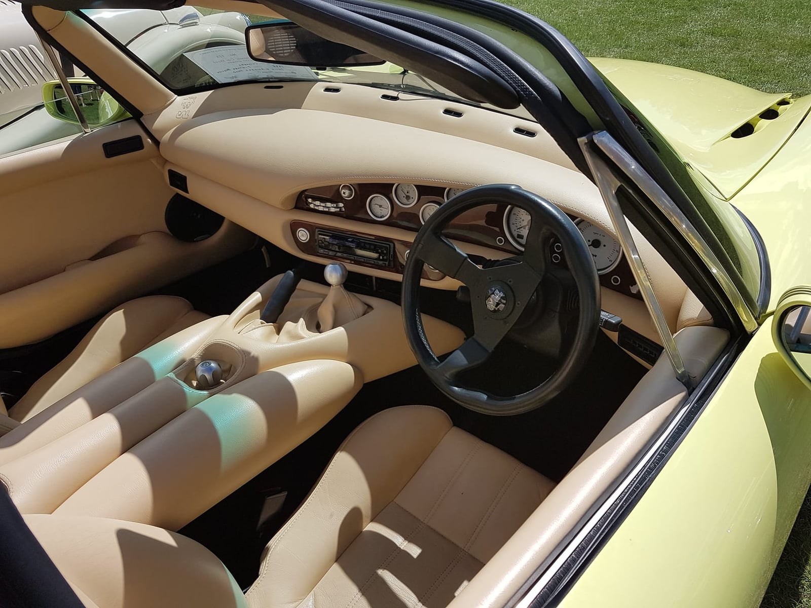 The cream leather interior of a 1998 TVR Chimaera showing sculpted seats and dashboard