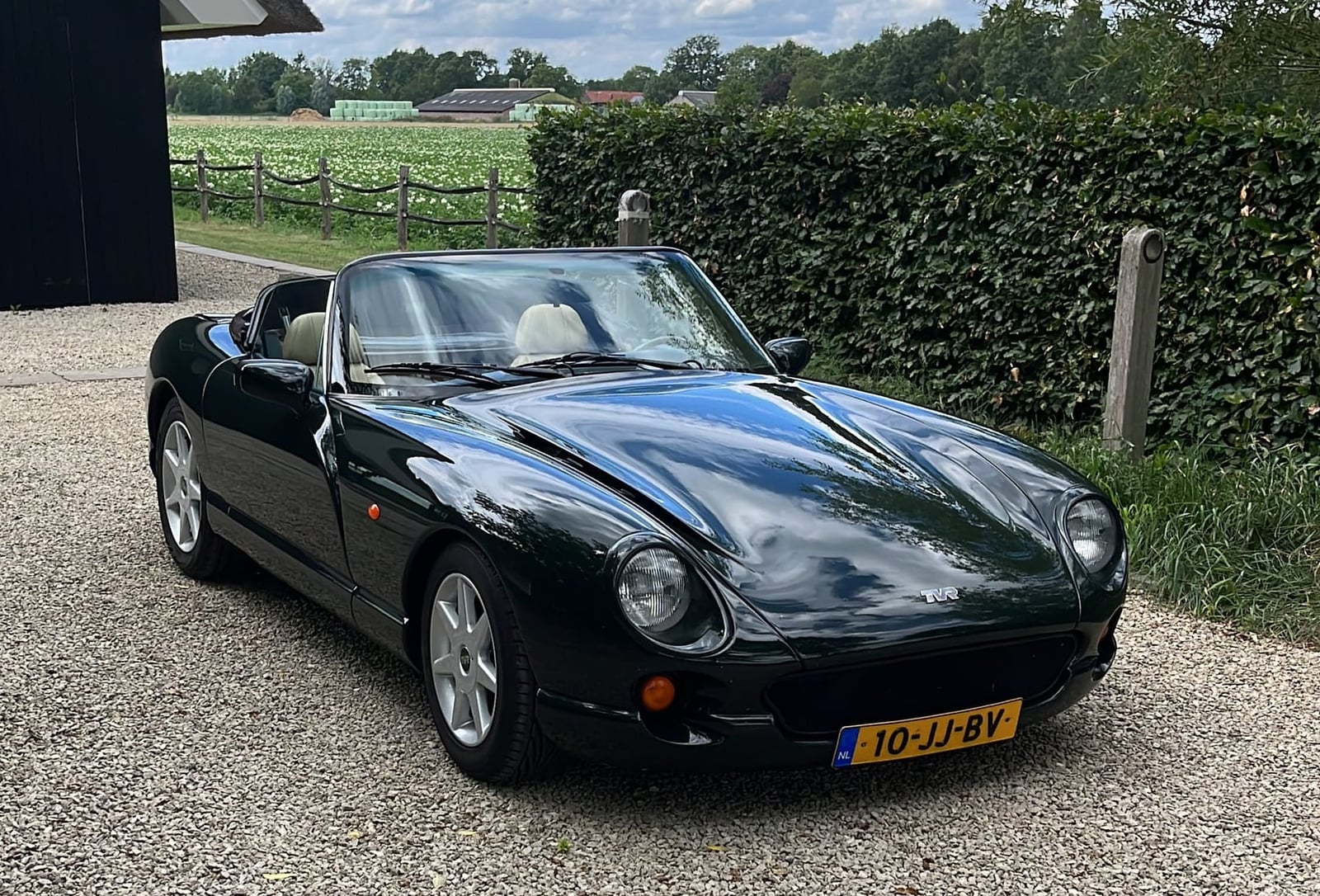 A silver TVR Chimaera 500 parked on cobbles beside a building, front three-quarter view, private registration B111 TVR