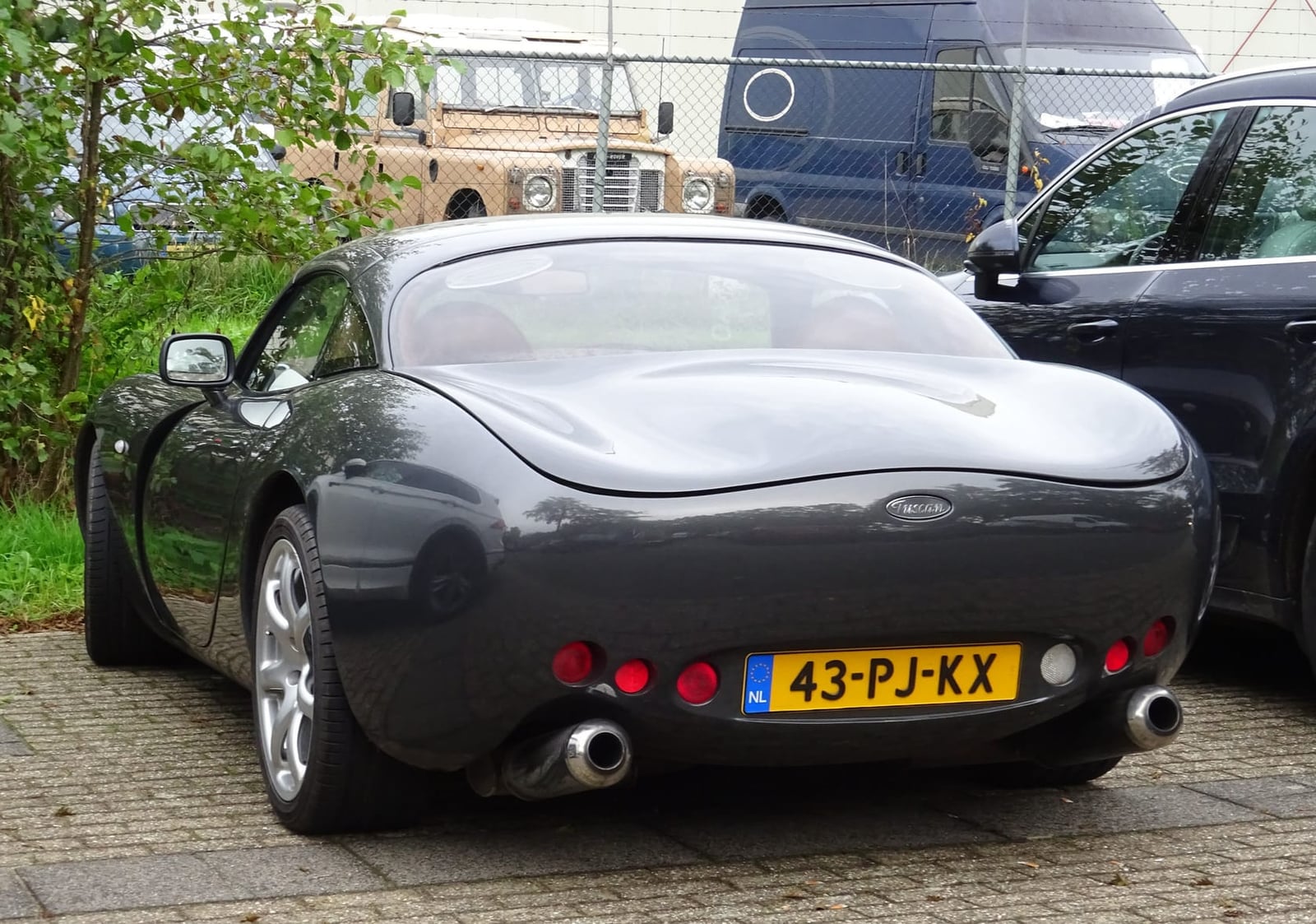 The rear view of a grey 2004 TVR Tuscan Mk 1 with Dutch registration 43-PJ-KX