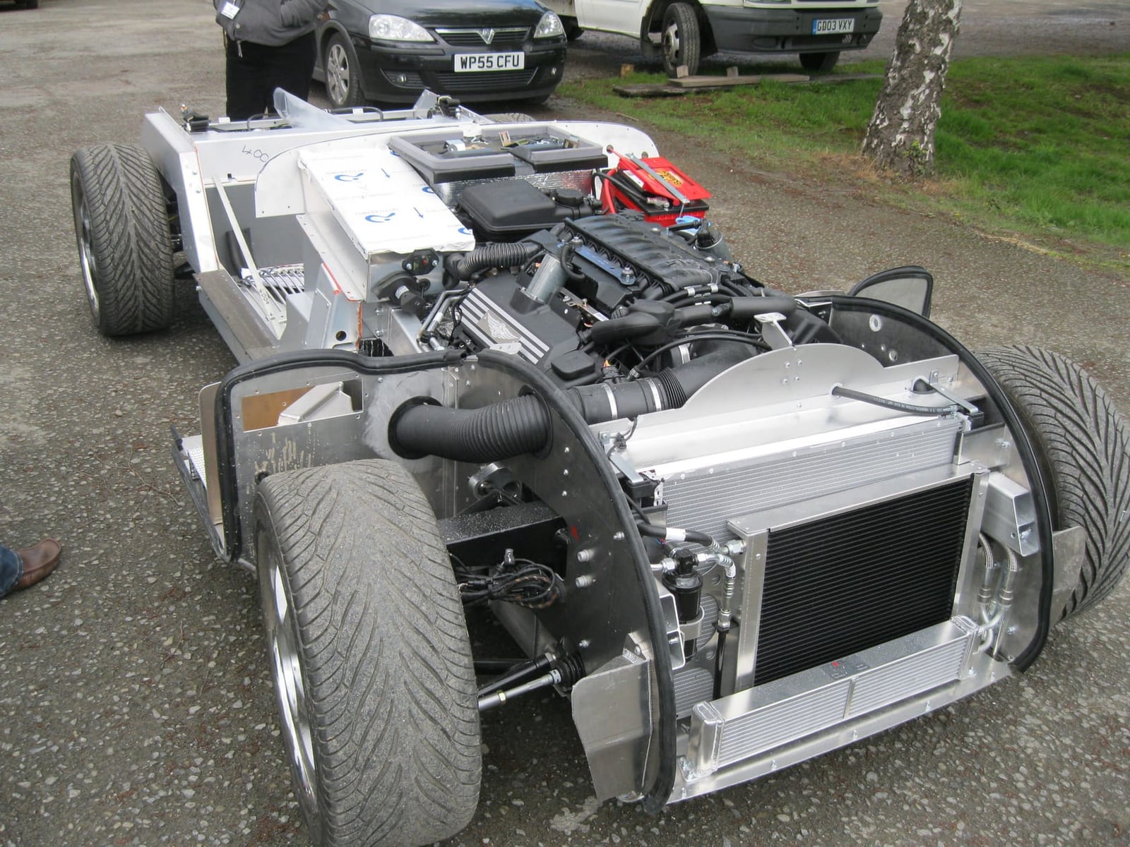 The bare bonded aluminium running chassis of a 2012 Morgan Plus 8 with its V8 engine fitted