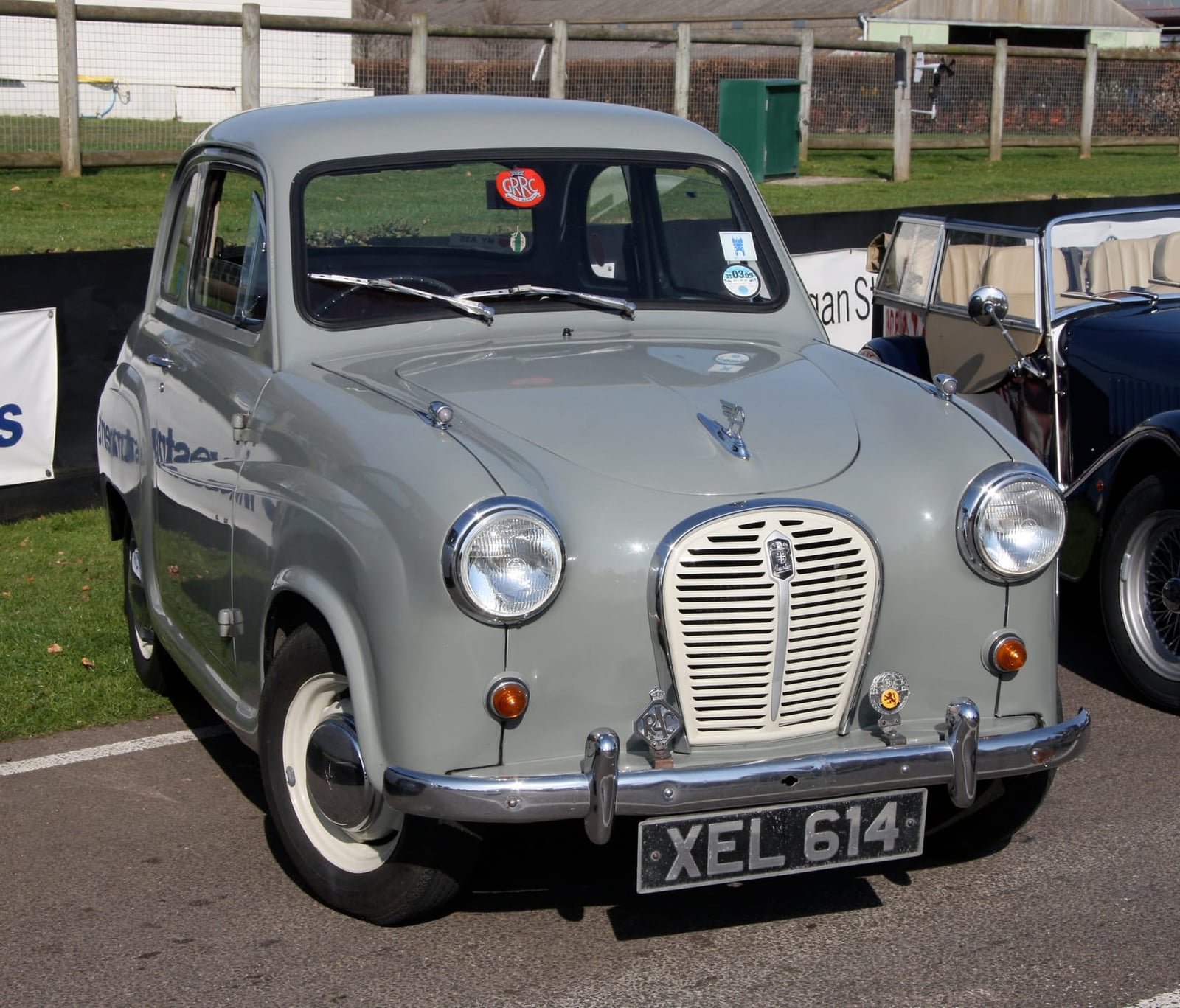 A grey Austin A35 at a classic car show, front three-quarter view, UK registration XEL 614