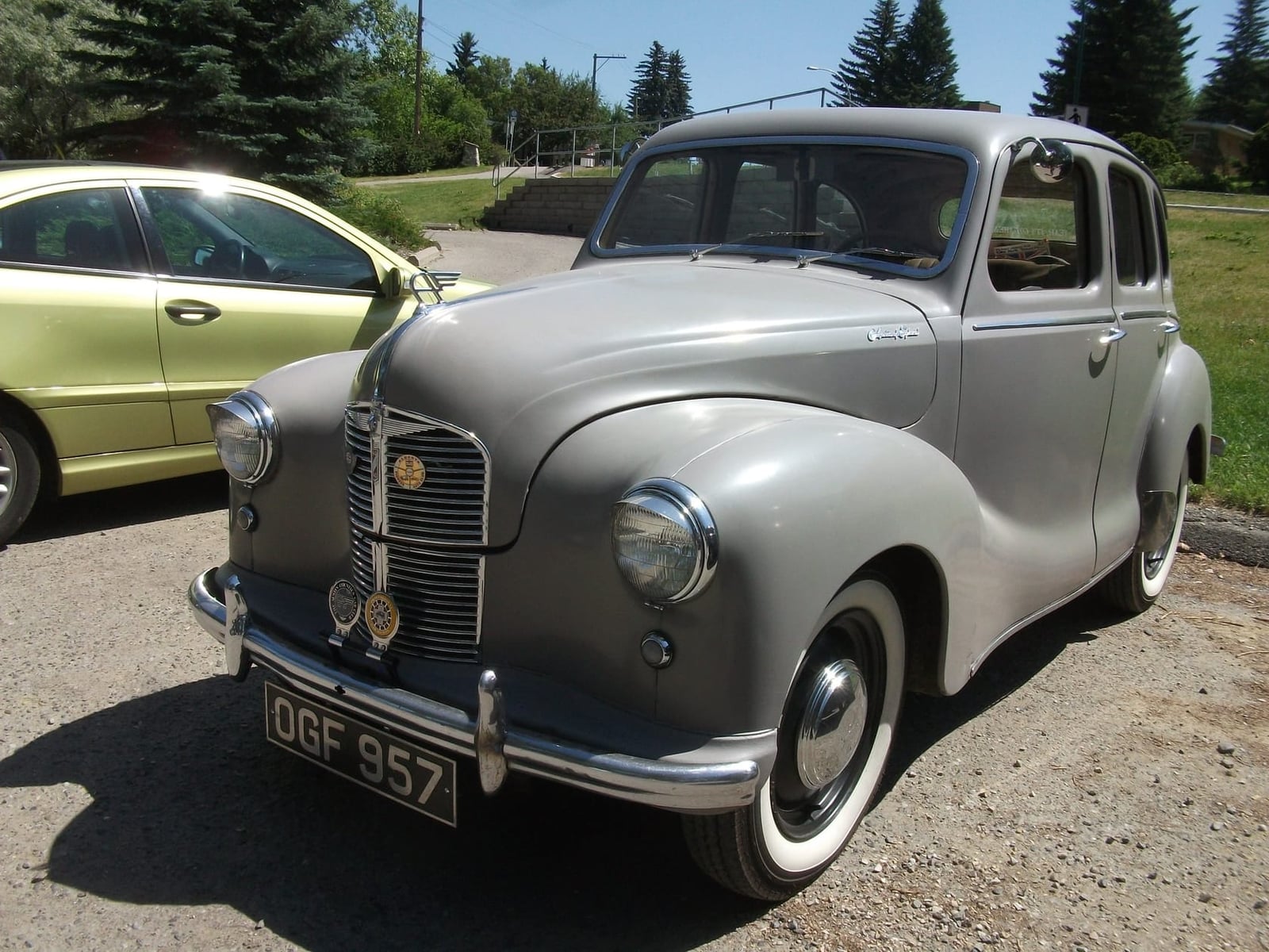 A grey Austin A40 Devon parked in a car park, front three-quarter view, UK registration OGF 957