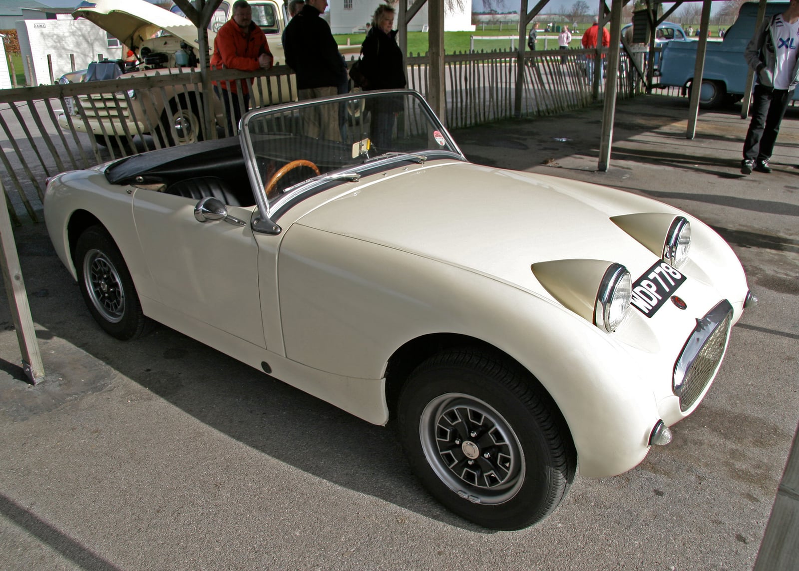 A cream Austin-Healey Frogeye Sprite at a show