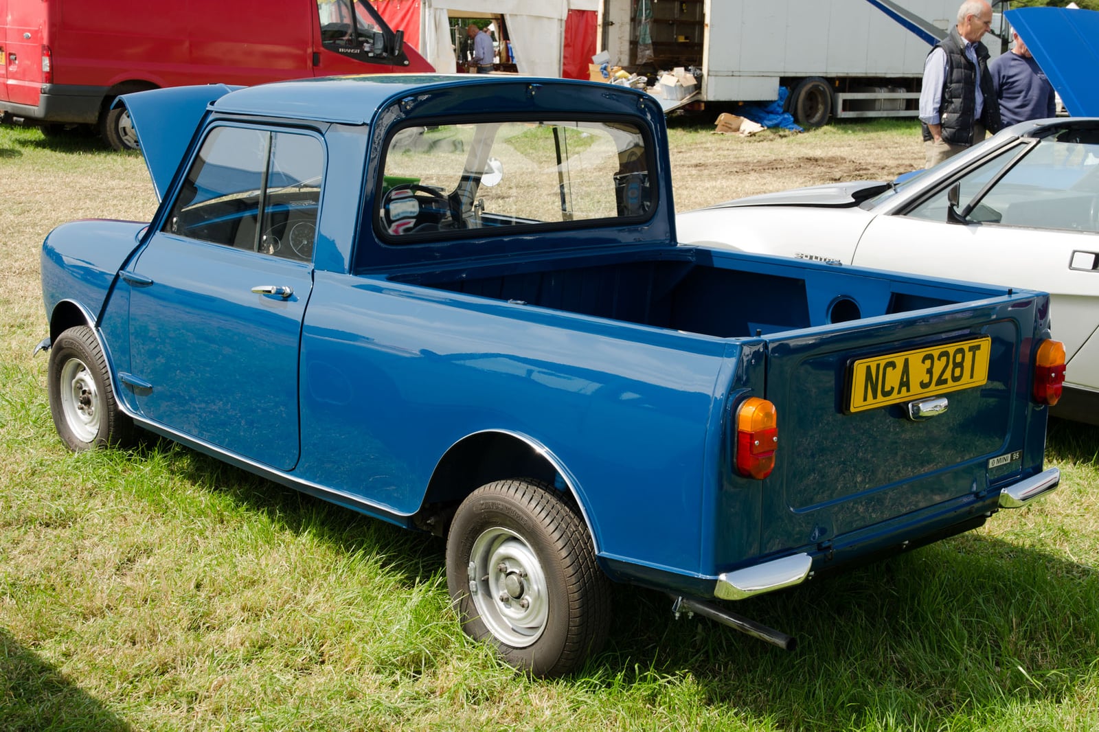 A fawn Mini Van at a show, front three-quarter view