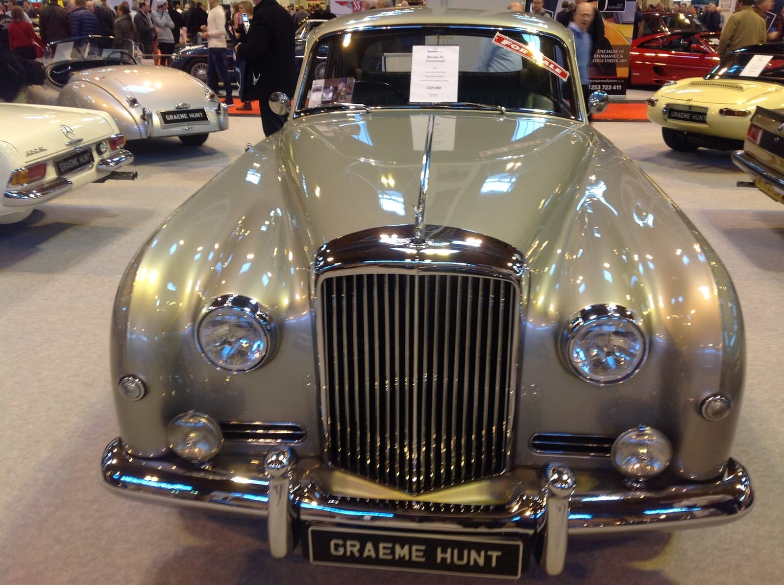 A champagne 1956 Bentley S1 Continental with Park Ward coachwork at an indoor show
