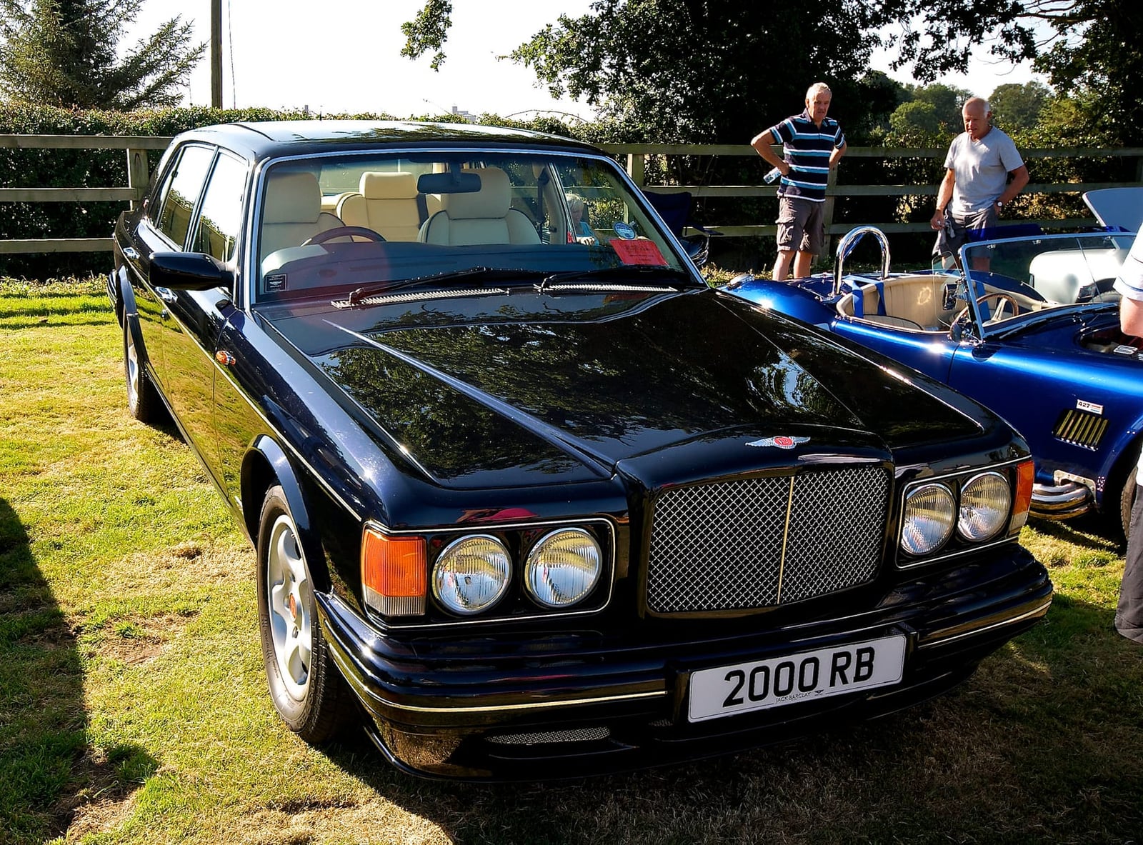 A black Bentley Turbo RT with UK registration 2000 RB at a classic car show