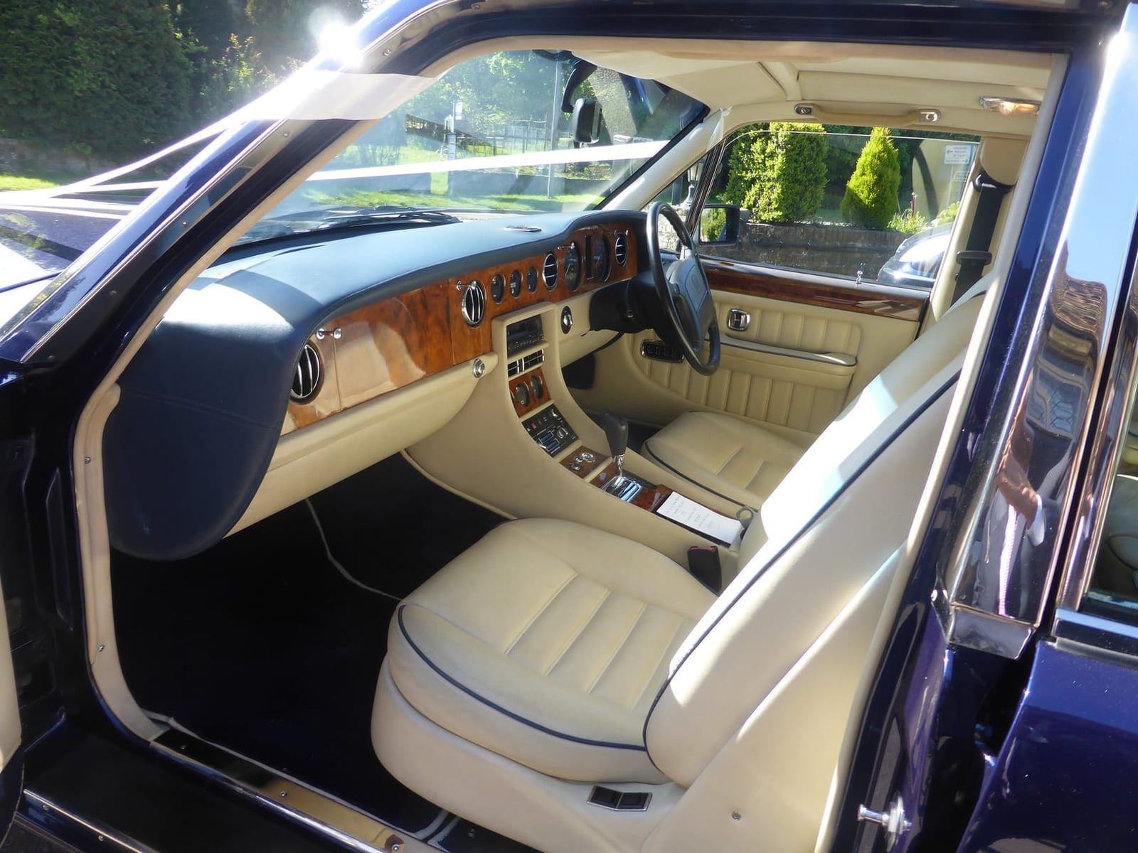 The cream leather and walnut interior of a 1995 Bentley Turbo R