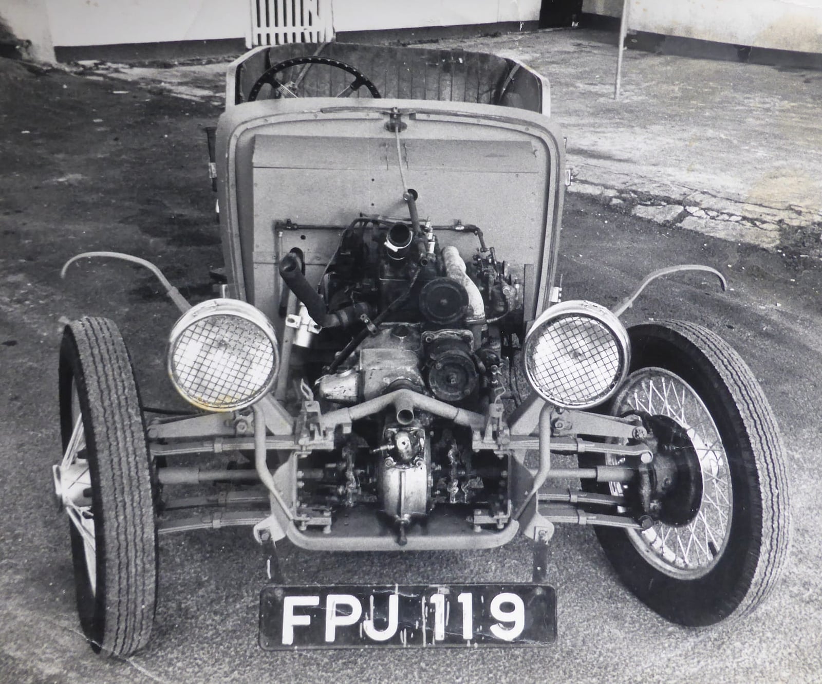 A period black and white photograph of a partly stripped 1937 BSA Scout showing its chassis